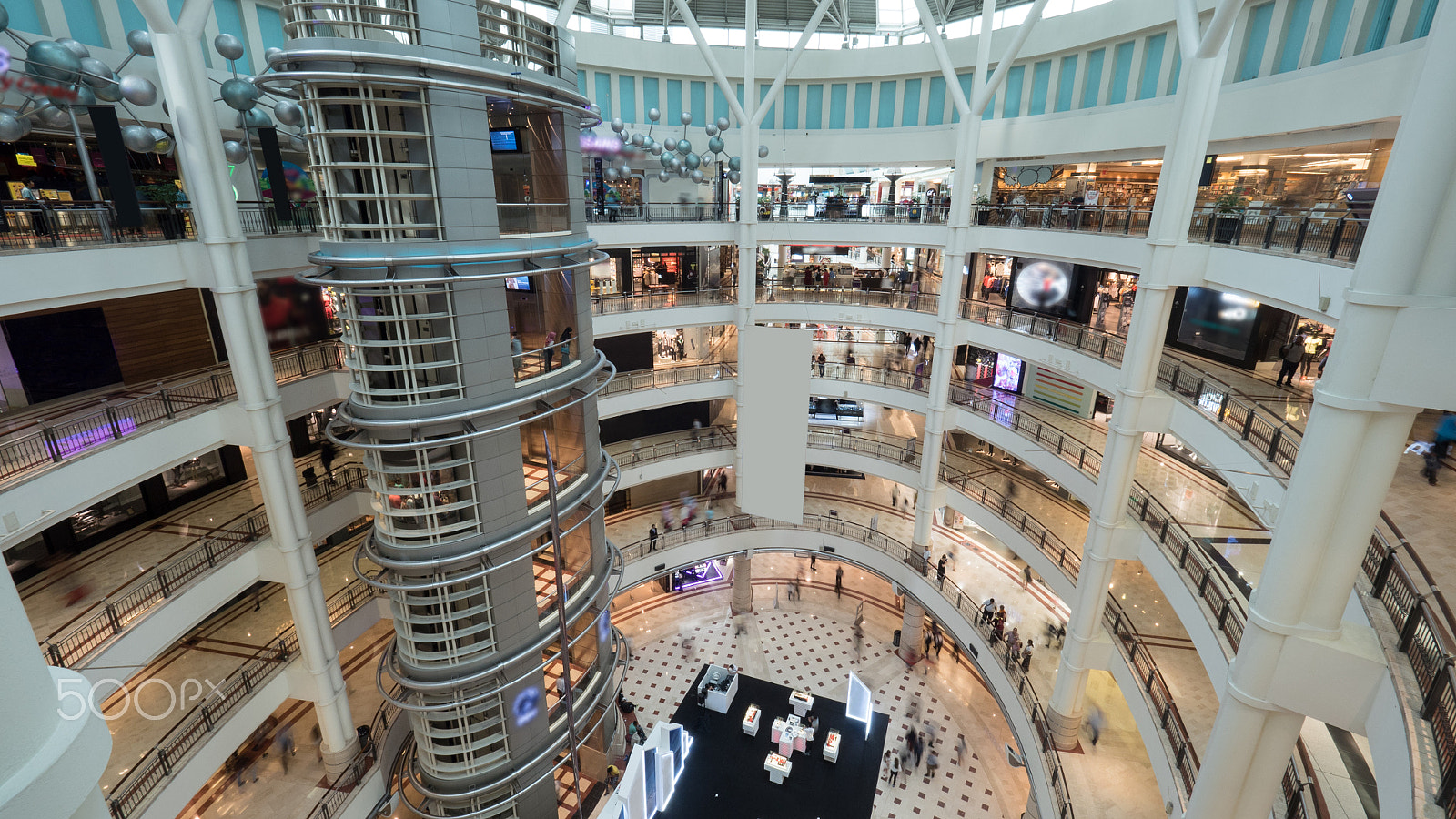 Panasonic Lumix DMC-GH4 + Olympus M.Zuiko Digital ED 7-14mm F2.8 PRO sample photo. Multistorey shopping mall with customers photography
