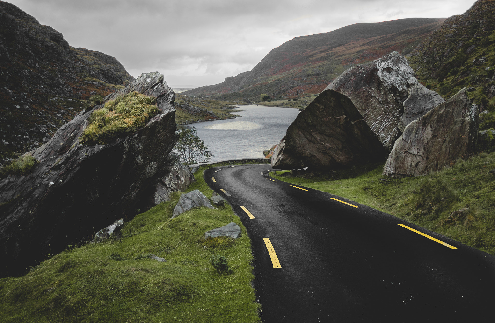 Olympus OM-D E-M5 II + Panasonic Lumix G 14mm F2.5 ASPH sample photo. Road at the end of the dark valley, ireland photography