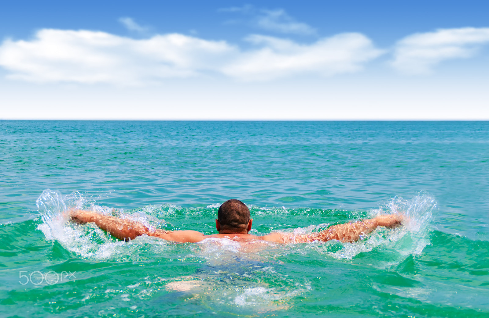 Nikon D60 sample photo. Man swims in the sea photography