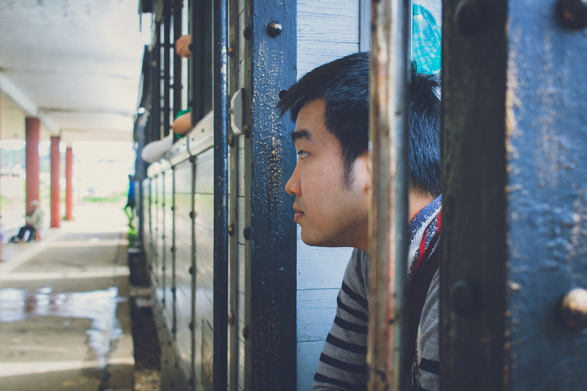 Canon EF-S 24mm F2.8 STM sample photo. Man at train station photography