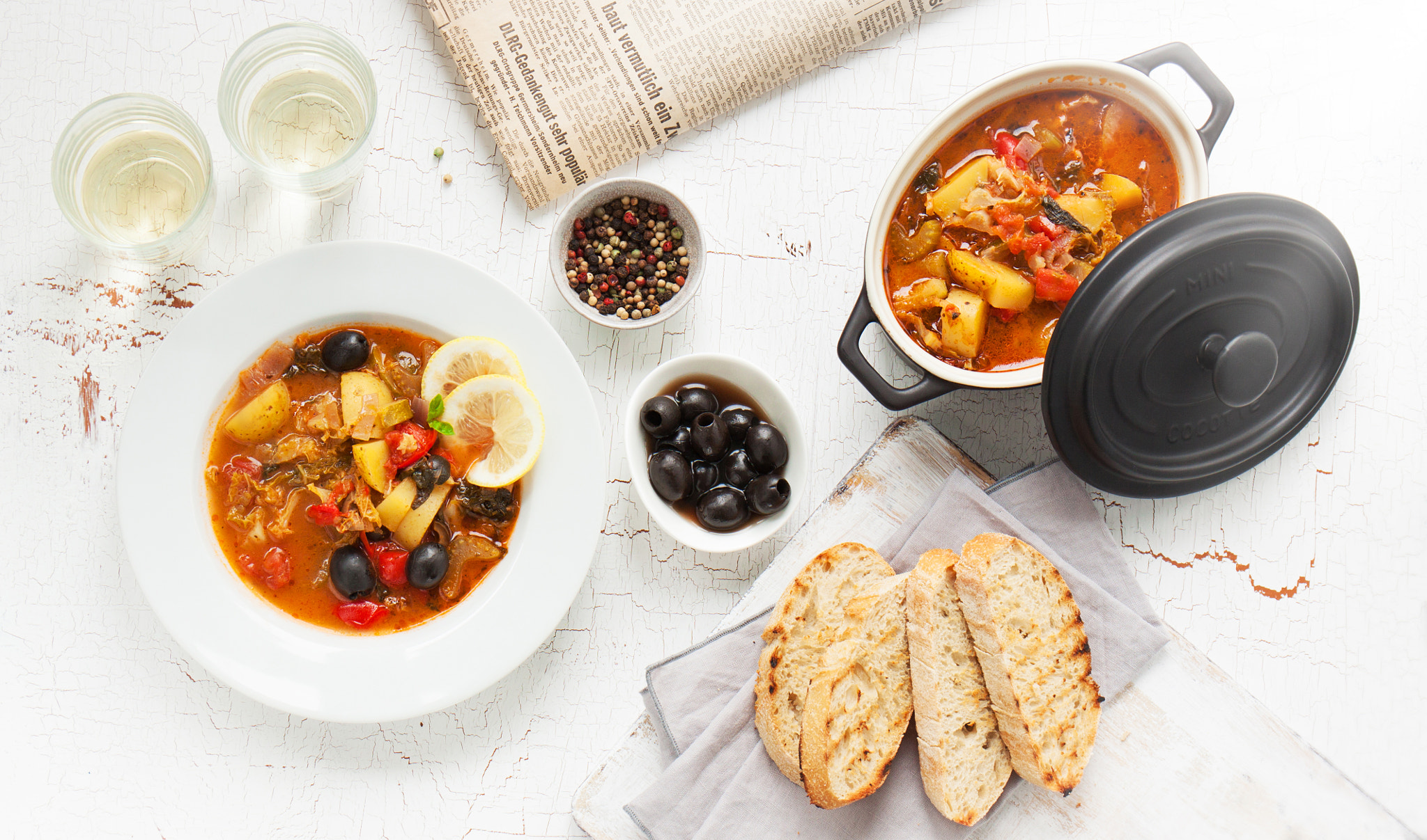 Canon EOS 50D sample photo. Italian dinner with italian soup minestrone, olives, bread, pepper and white wine, top view photography