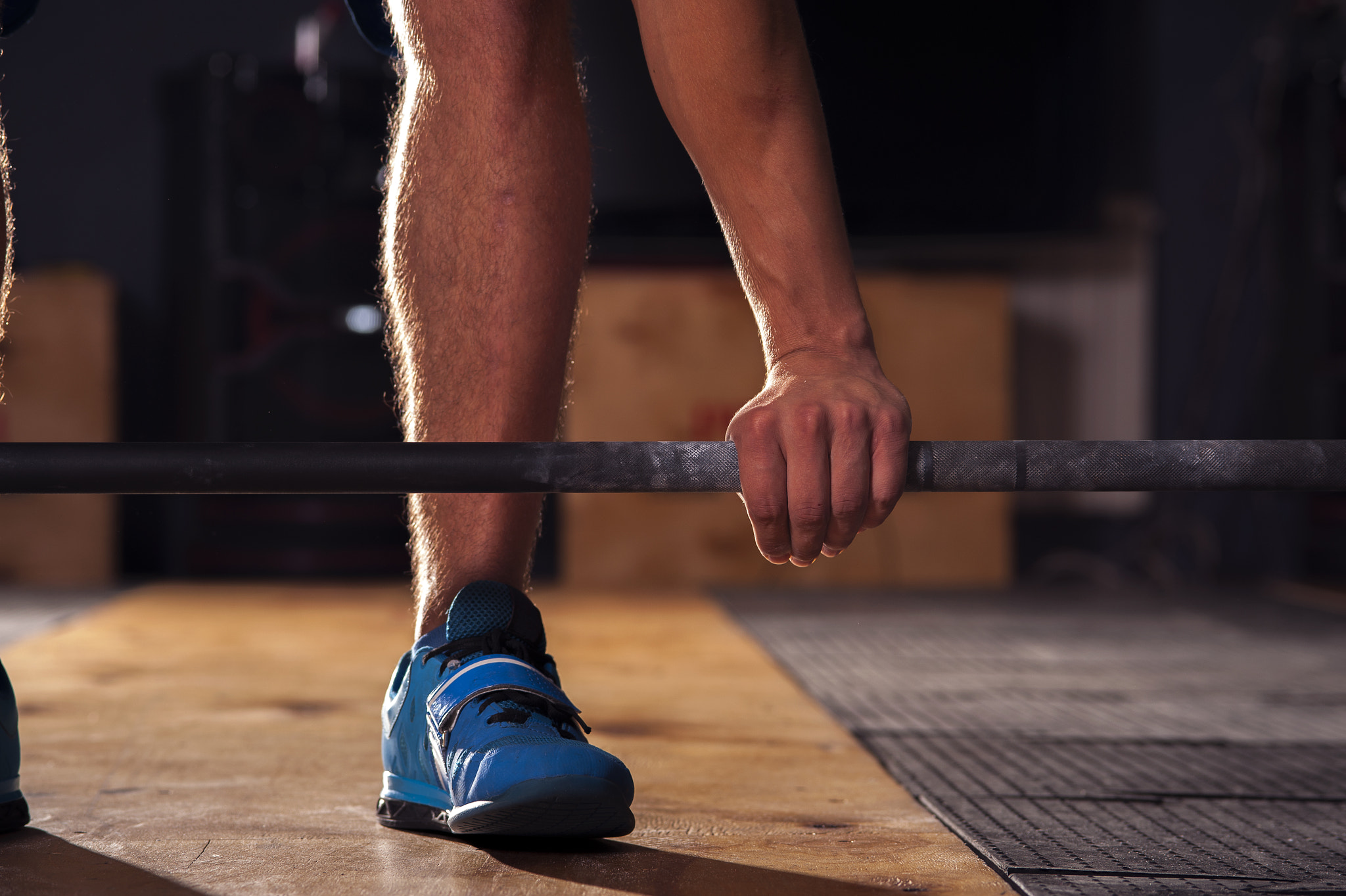 Nikon D700 + AF Micro-Nikkor 105mm f/2.8 sample photo. Male athlete holding barbell, closeup photography