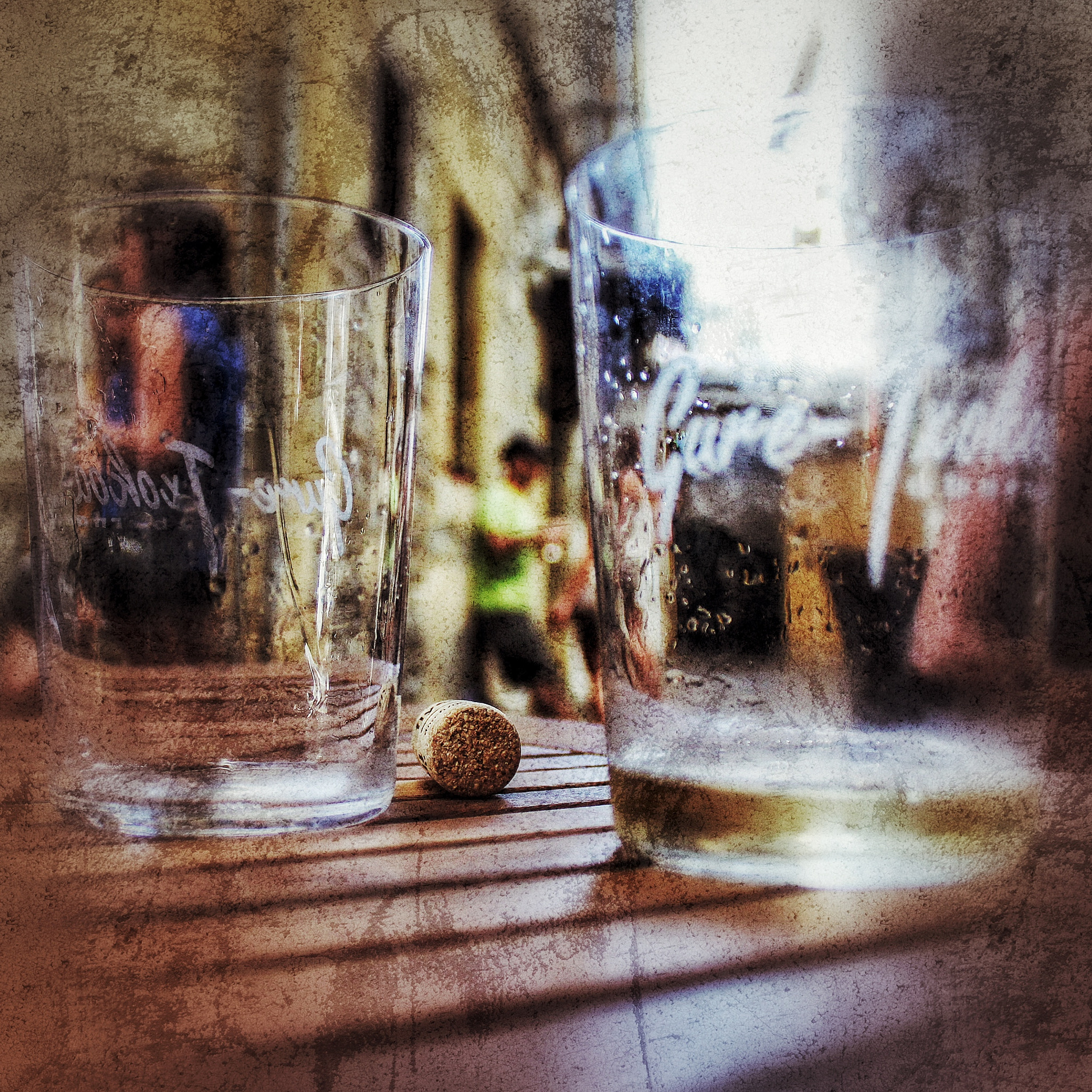Canon EF-S 18-55mm F3.5-5.6 IS II sample photo. Two empty glasses and a wine bottle cork with people in the background photography