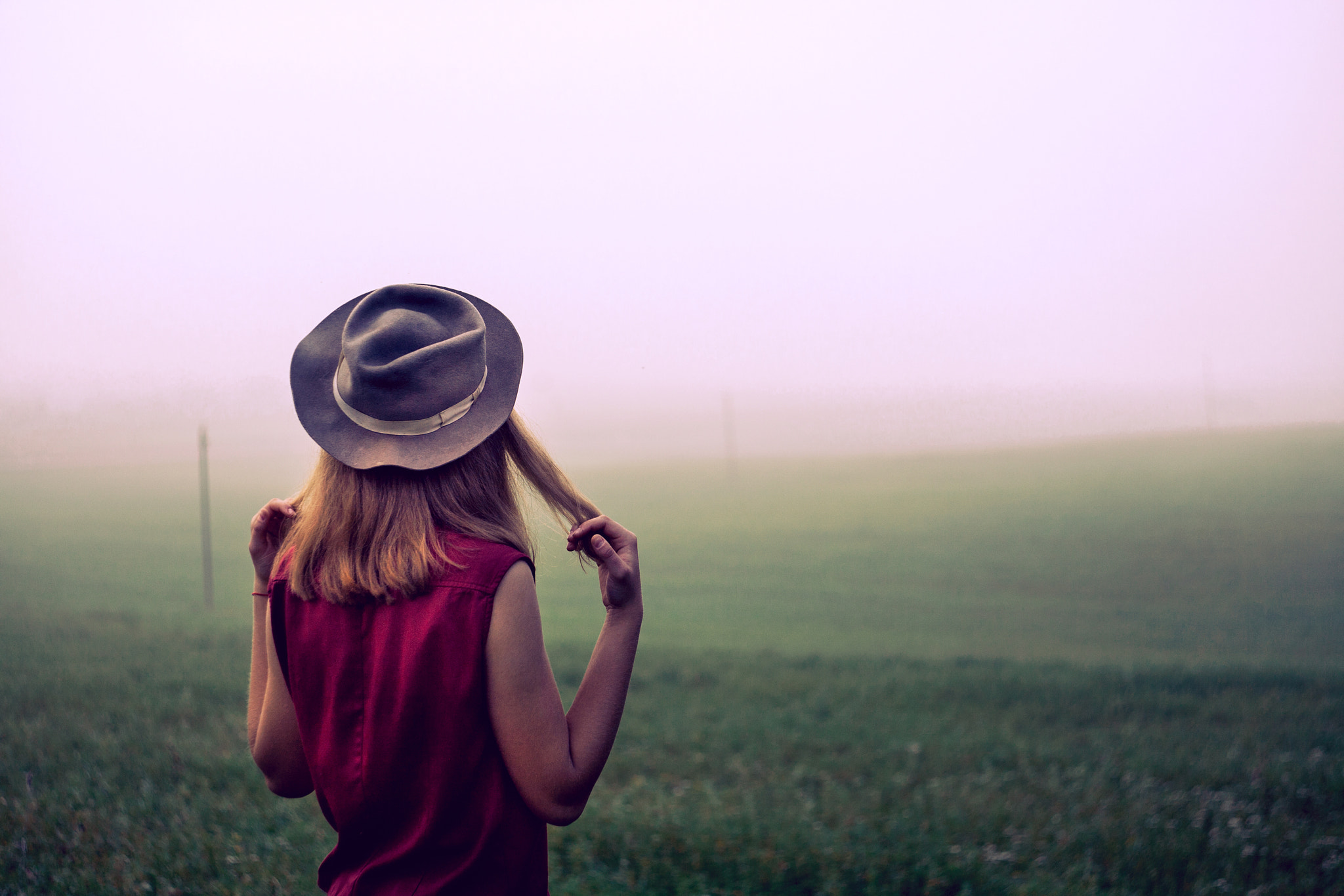 Canon EOS 5D sample photo. Beatiful young girl in  a field with hat at sunrise in fog back to camera photography