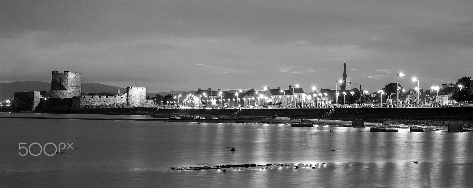 Sony Alpha a5000 (ILCE 5000) + Sony E PZ 18-105mm F4 G OSS sample photo. Carrickfergus long exposure at night b&w photography