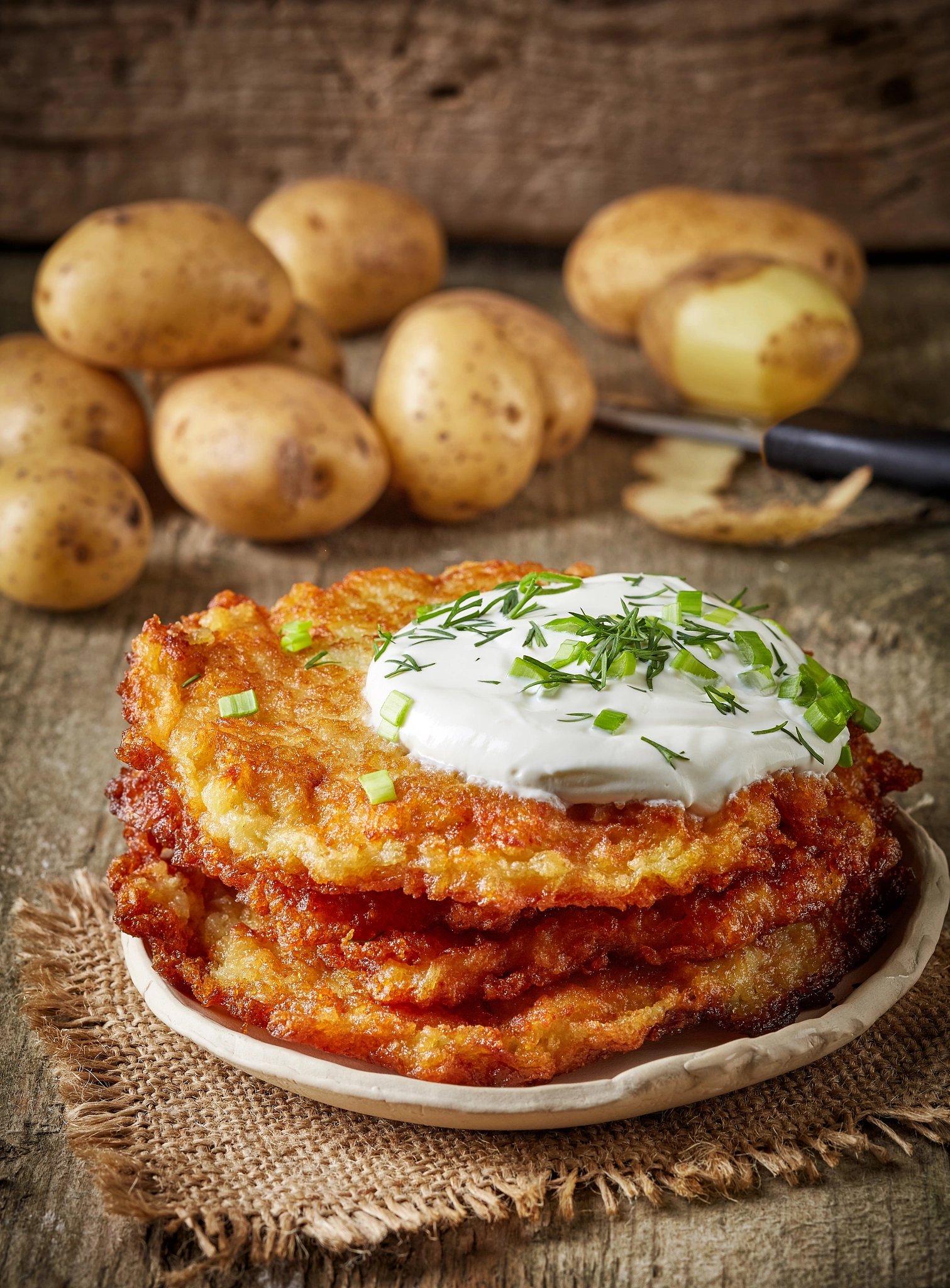 Canon TS-E 90mm F2.8 Tilt-Shift sample photo. Potato pancakes on wooden table photography