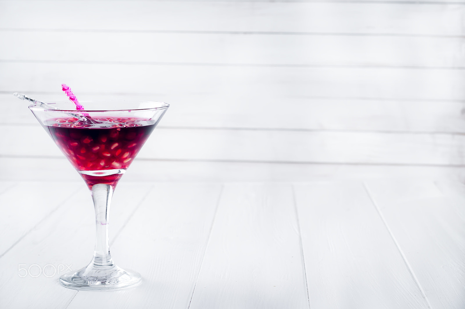 Nikon D90 + AF Nikkor 50mm f/1.8 sample photo. Pomegranate martini with  seeds in a glass photography