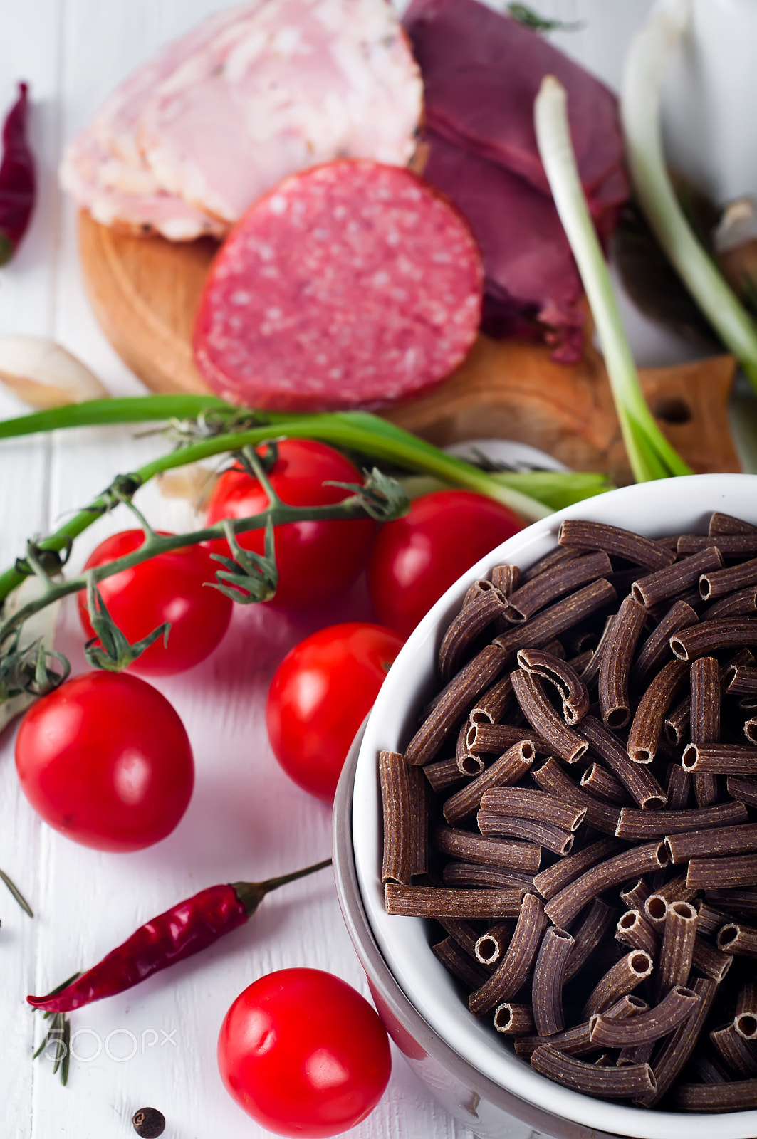 Nikon D90 + AF Nikkor 50mm f/1.8 sample photo. Dry italian pasta spiraline, red cherry tomatoes, saussage, still life photography