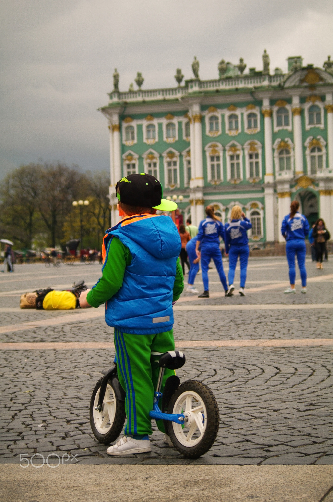 Little child on first bicycle. Active leisure for kids. Learning to ride a bike