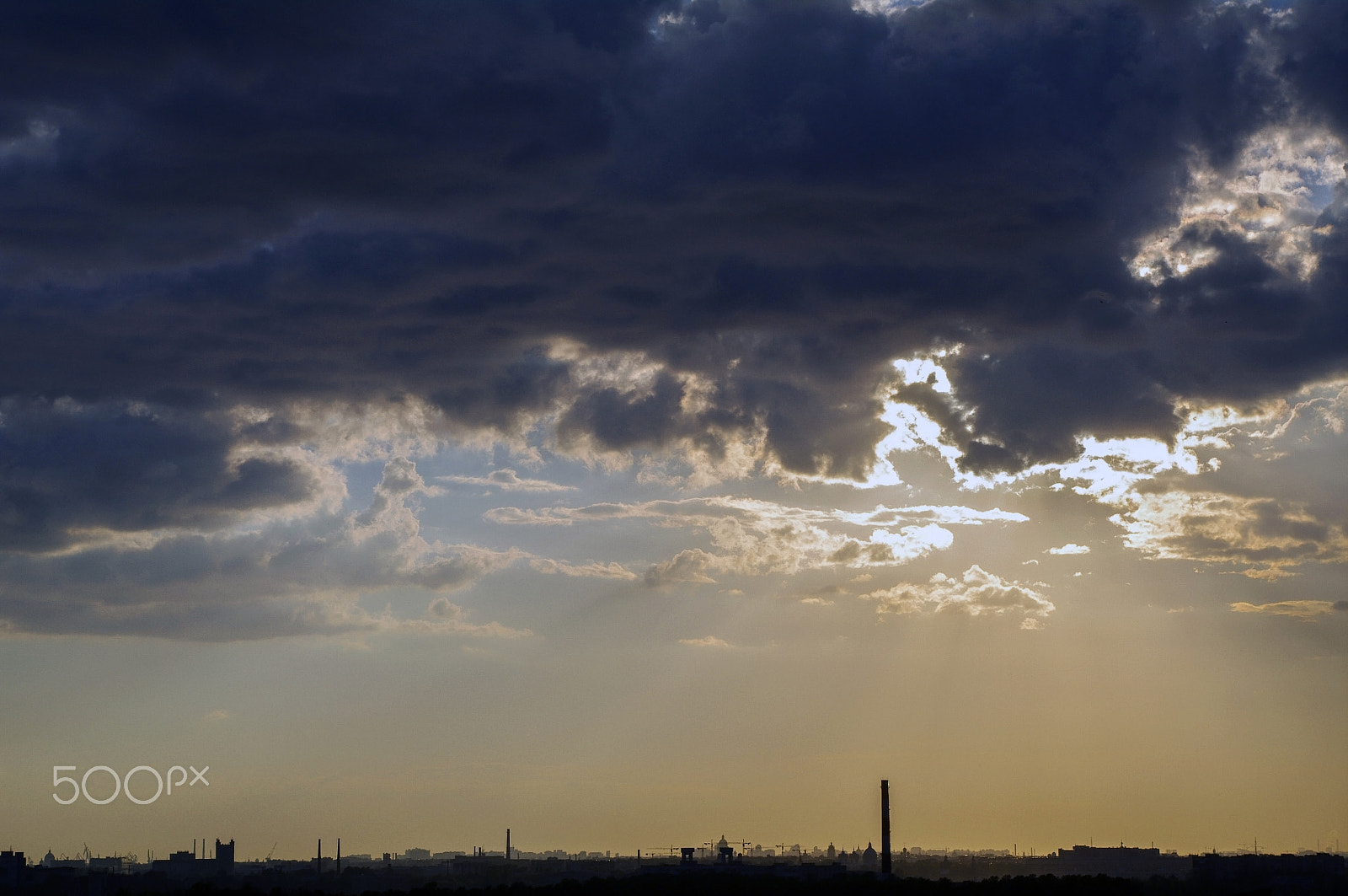 Pentax K-7 + smc PENTAX-DA L 18-55mm F3.5-5.6 sample photo. Amazing dramatic sunset with beautiful sun beams over clouds in photography