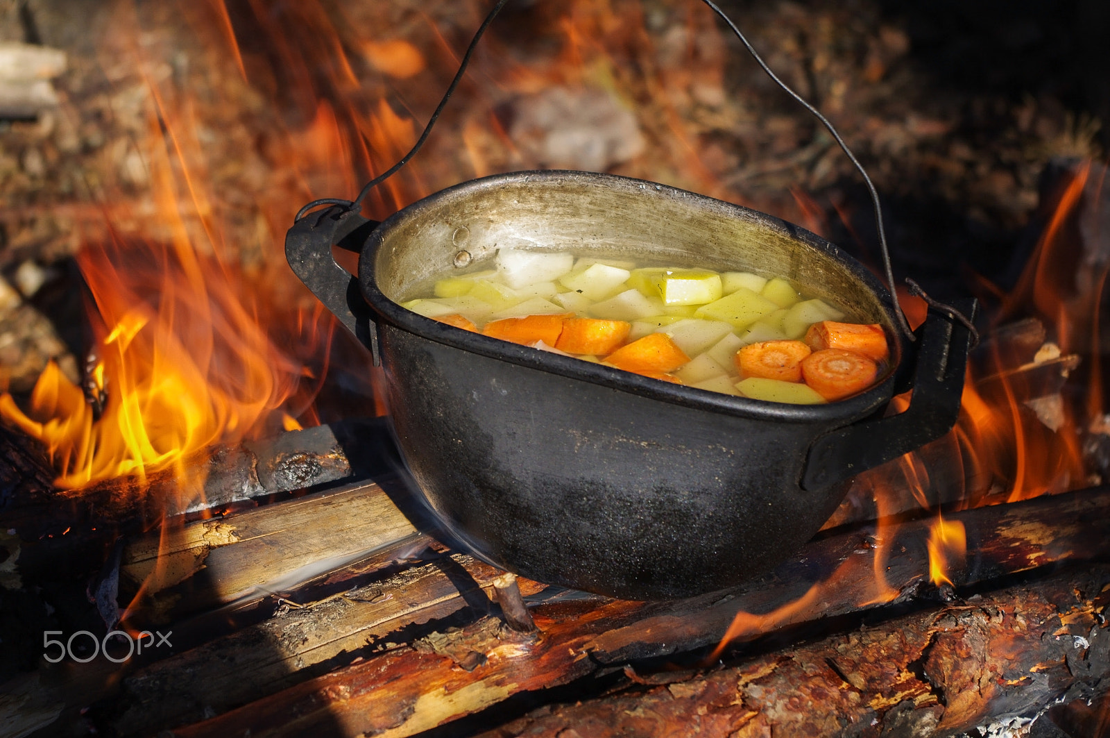 Pentax K-7 sample photo. Vegetables prepared in a pot over fire on the nature photography