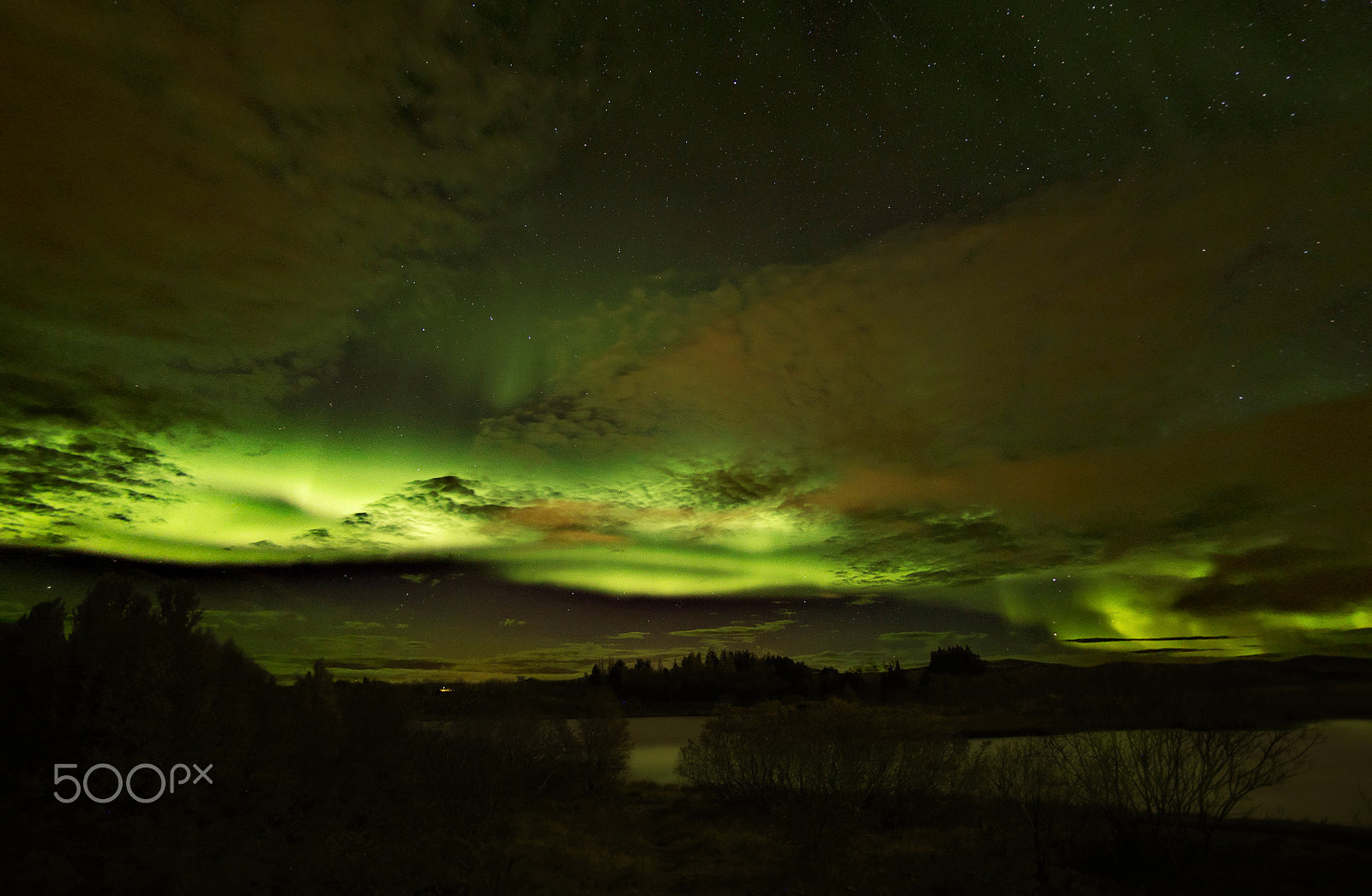 Canon EOS 6D + Canon EF 28mm F2.8 sample photo. Aurora borealis with green and orange clouds near reykjavik photography