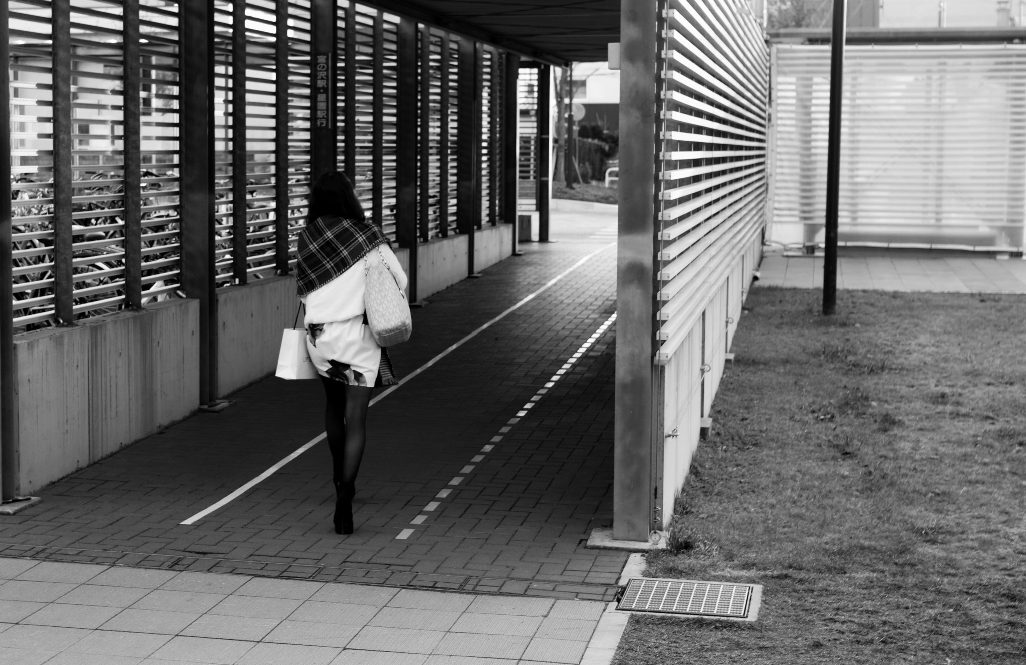 Sony a6000 sample photo. Female college student heading to the bus stop photography