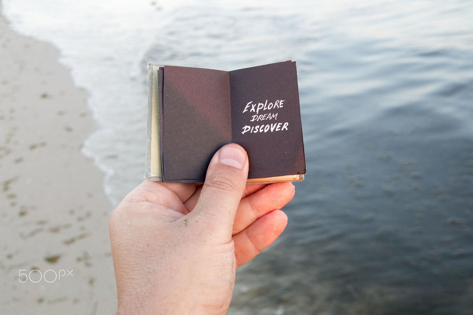 Sigma 18-200mm f/3.5-6.3 DC OS sample photo. Explore dream discover. book, inscription, and sandy beach. photography