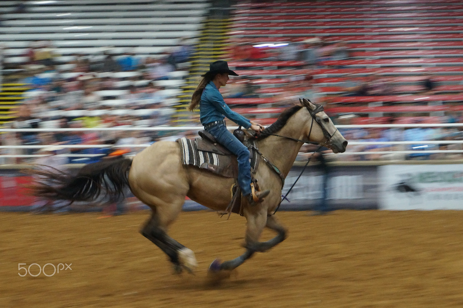 Sony Alpha NEX-5T + Sony E 18-50mm F4-5.6 sample photo. A horse rider at a rodeo show photography