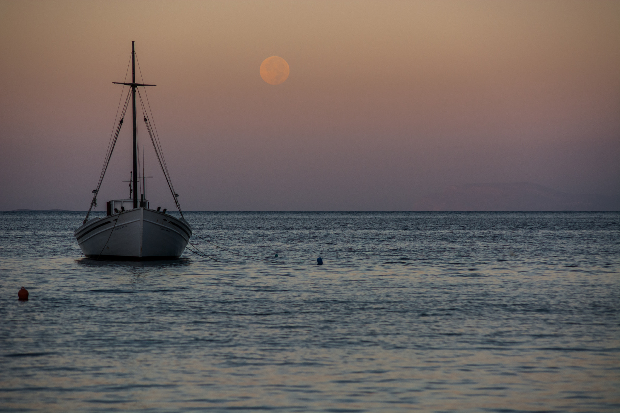 Nikon D7100 + Sigma 50-150mm F2.8 EX APO DC HSM II sample photo. Moonset over the aegean photography