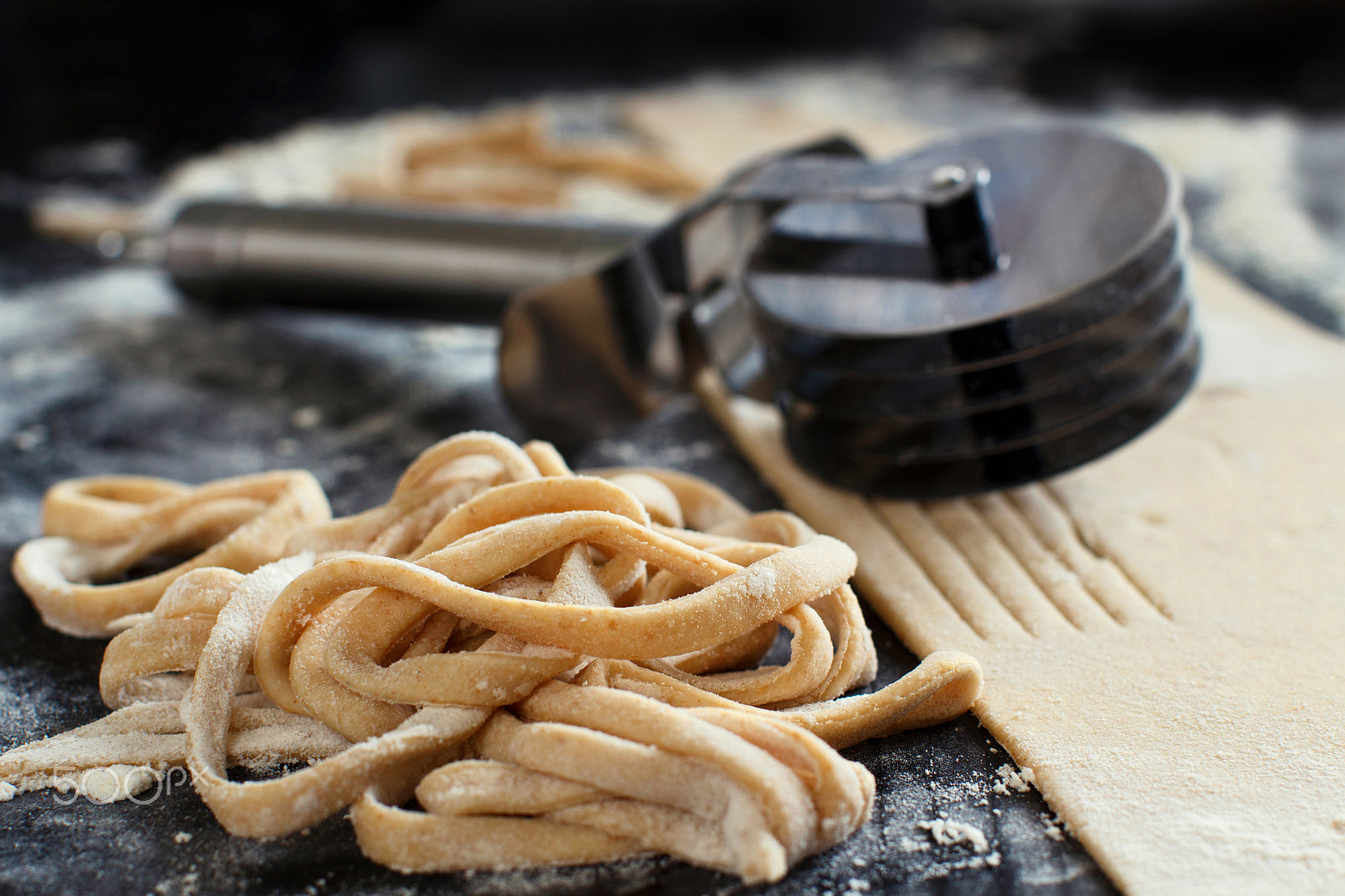 Canon EOS 650D (EOS Rebel T4i / EOS Kiss X6i) + Canon EF 50mm F1.2L USM sample photo. Making taglatelle with a pasta rolling cutter photography
