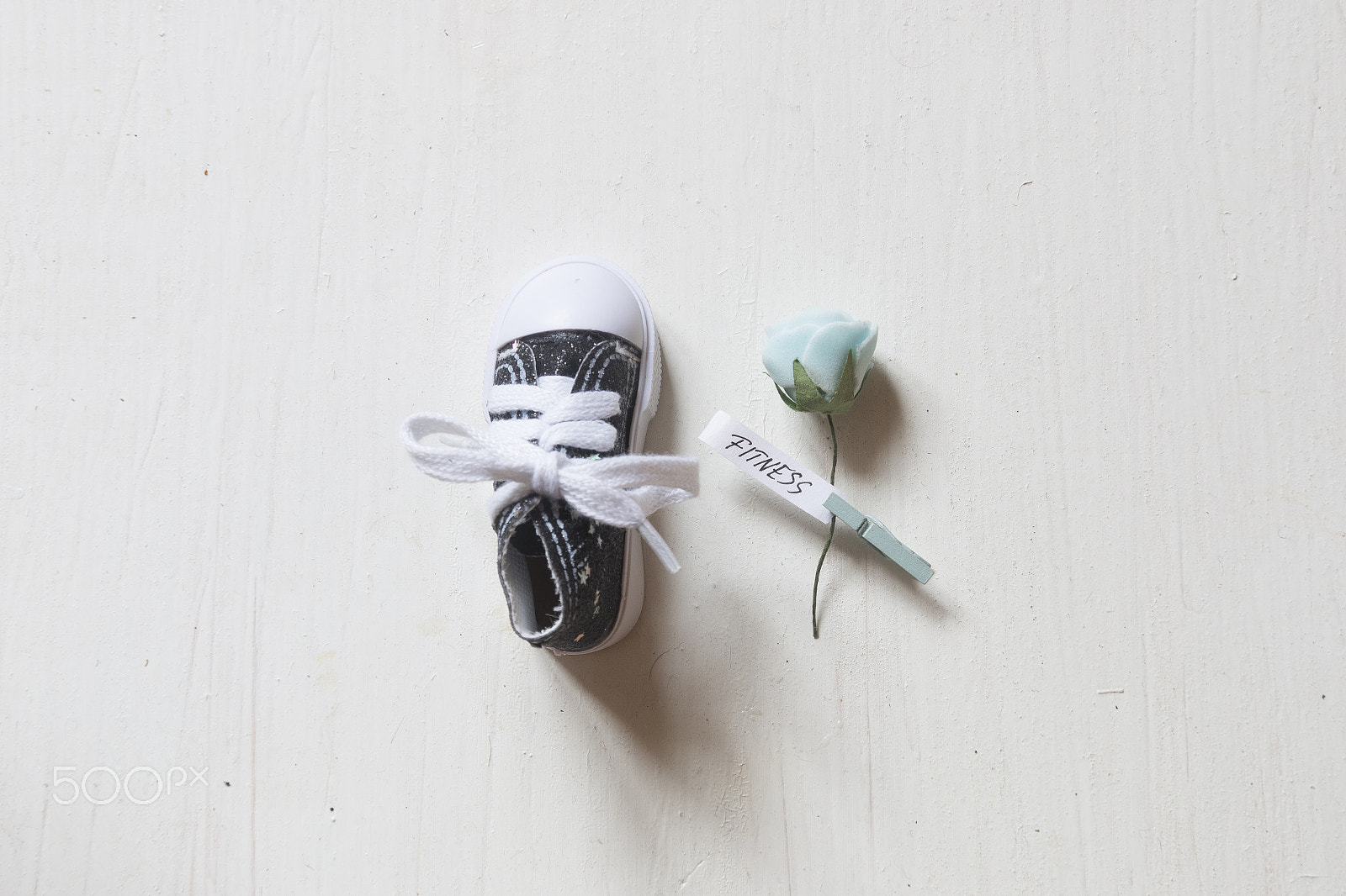 Sigma 18-200mm f/3.5-6.3 DC OS sample photo. Fitness training concept, flower with text and one shoe. photography