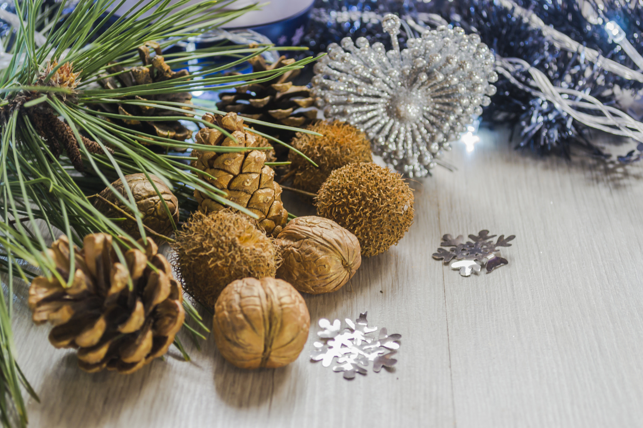 Pine cones with walnuts and candle