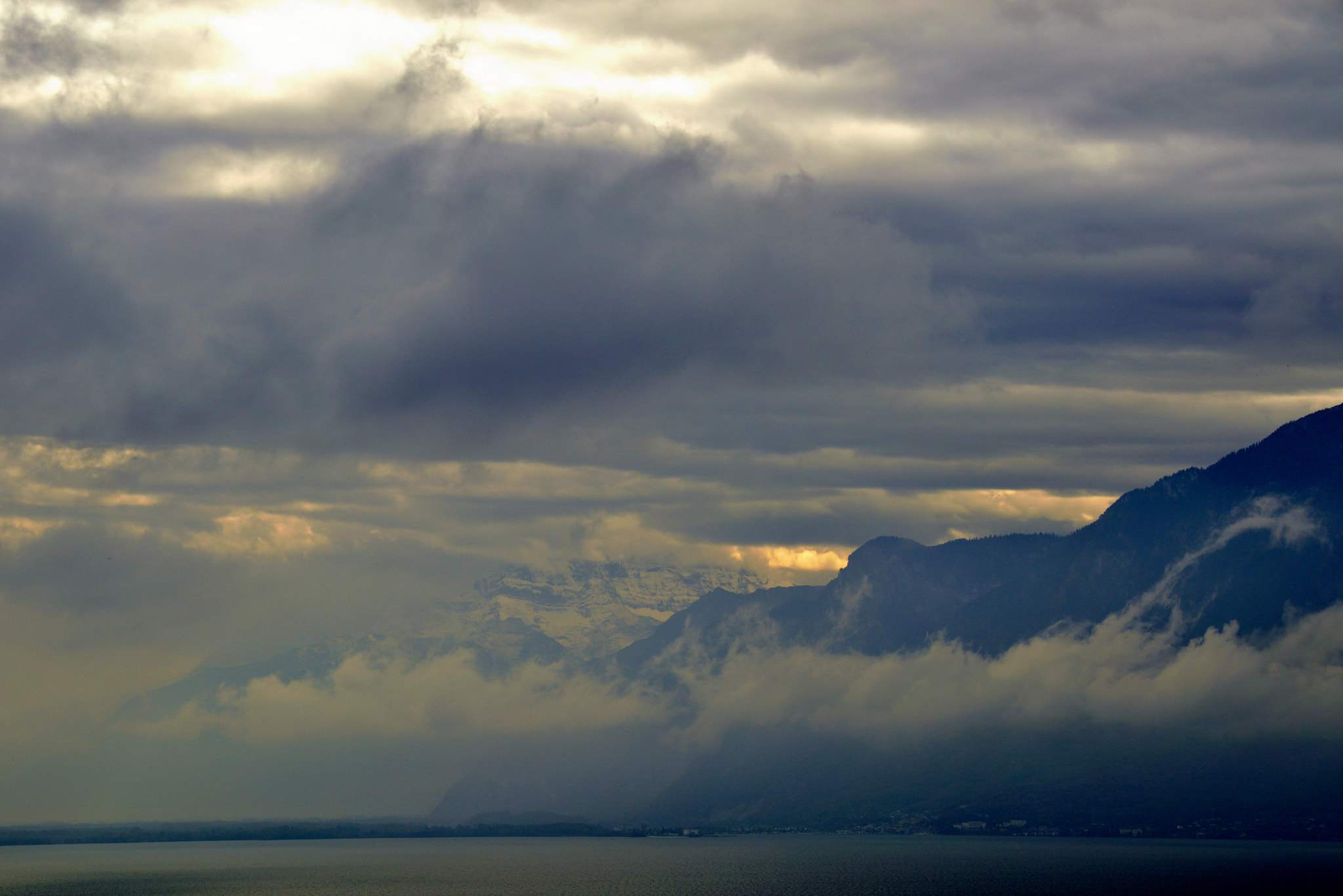 Nikon D3200 + Sigma 18-200mm F3.5-6.3 II DC OS HSM sample photo. Raining over the lake photography