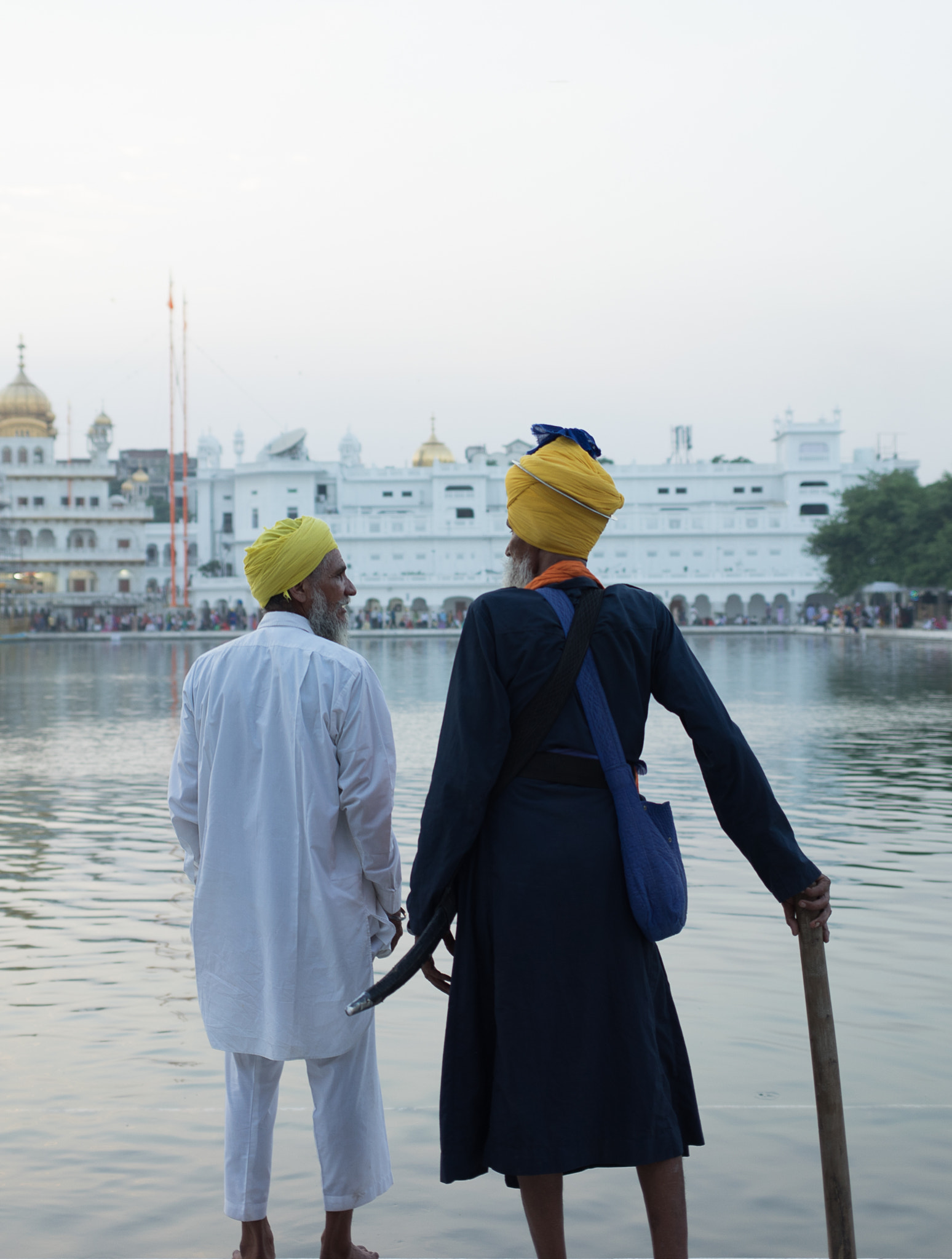 E 35mm F2 sample photo. Sikh dudes by the pool photography
