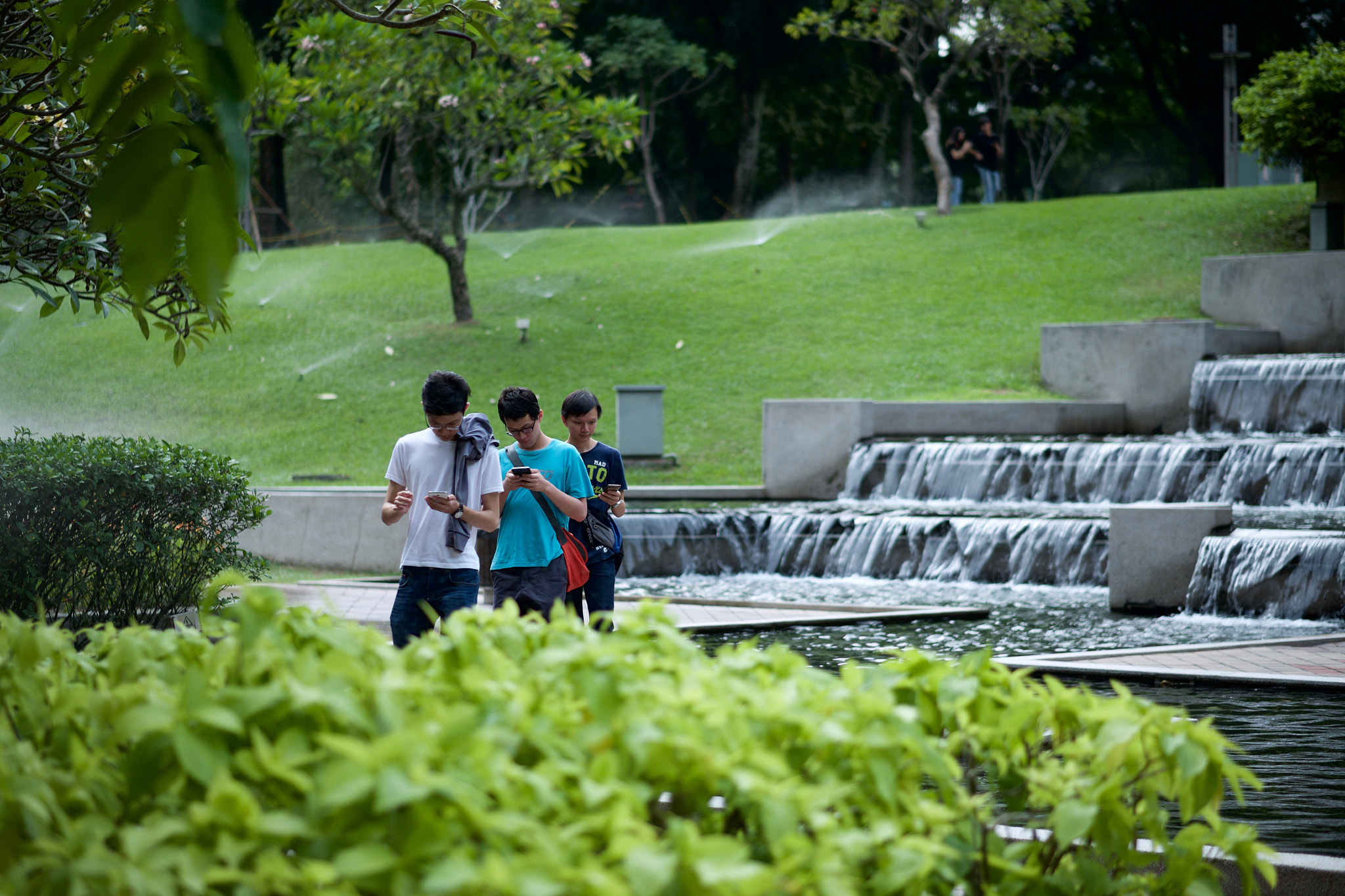 Fujifilm X-T1 + Fujifilm XF 56mm F1.2 R APD sample photo. 3 dude 3 phone 3 pokemon photography