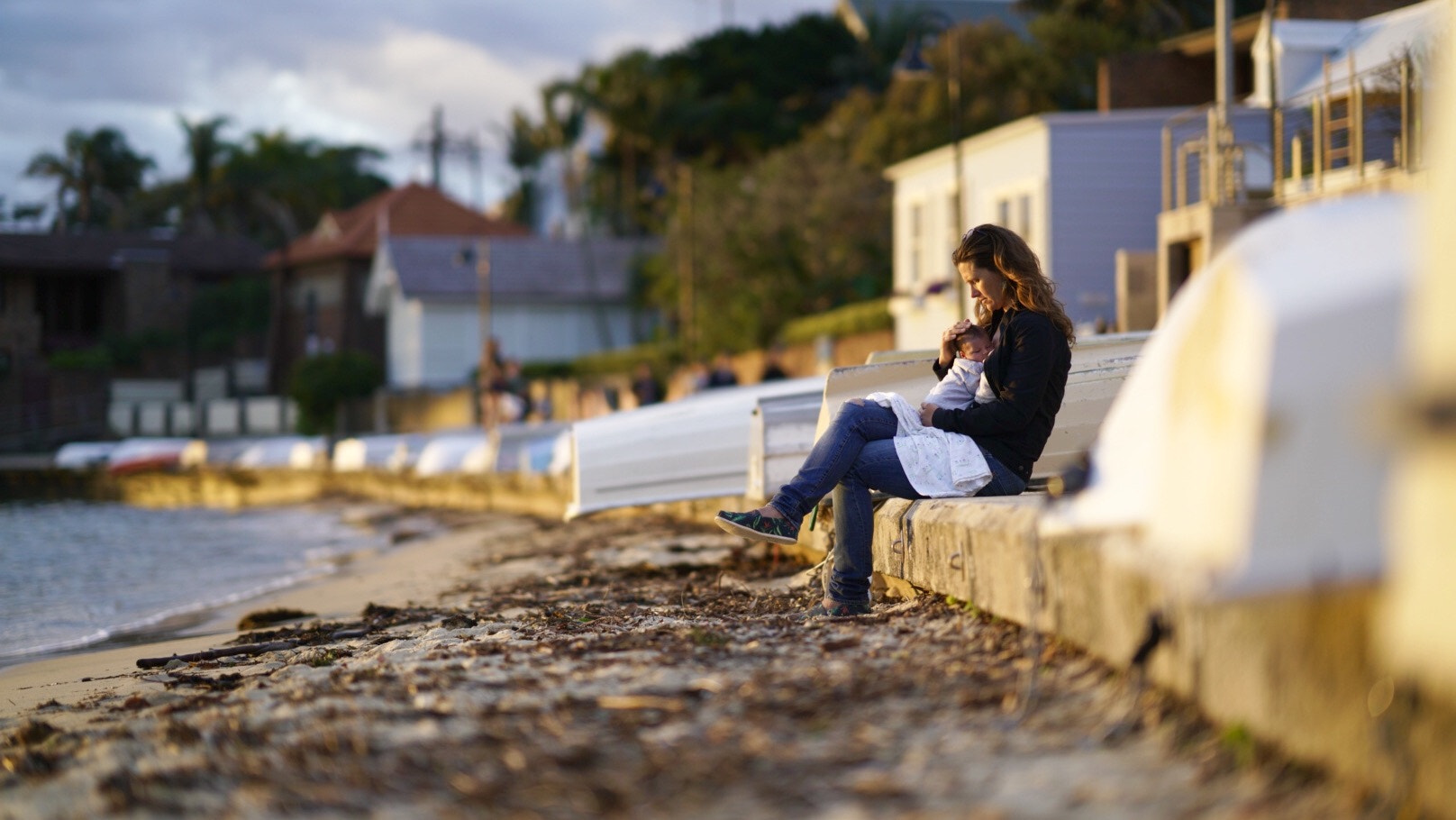 Sony FE 85mm F1.4 GM sample photo. Beautiful new mum taking a moment to enjoy the sunset with our little girl. photography