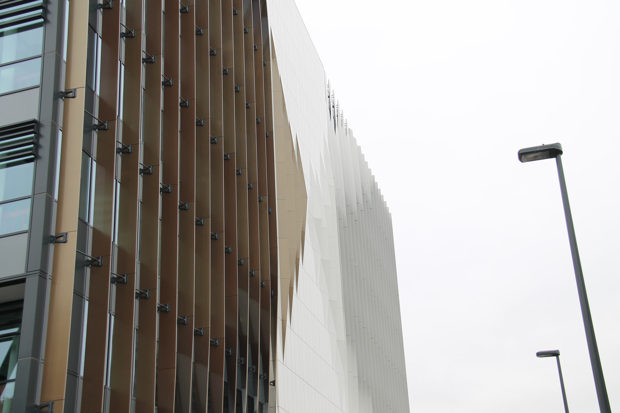 Canon EF-S 18-200mm F3.5-5.6 IS sample photo. Wavy building photography
