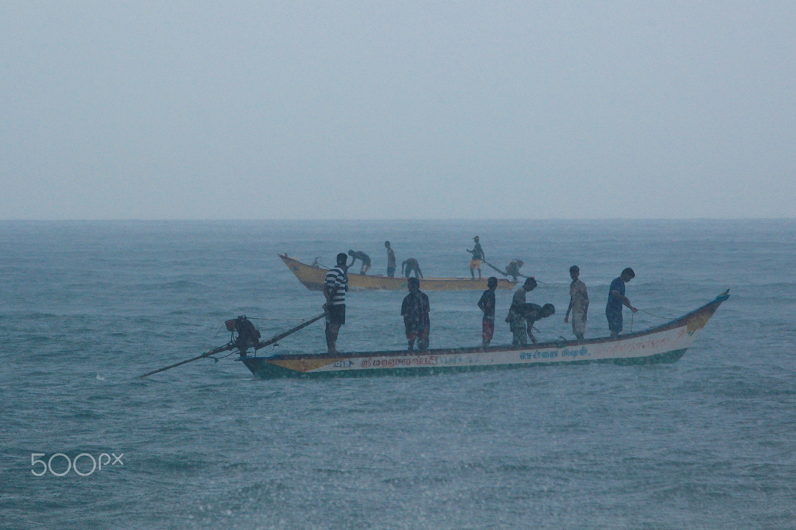 Canon EF 70-300mm F4-5.6L IS USM sample photo. Fishing during heavy rain photography