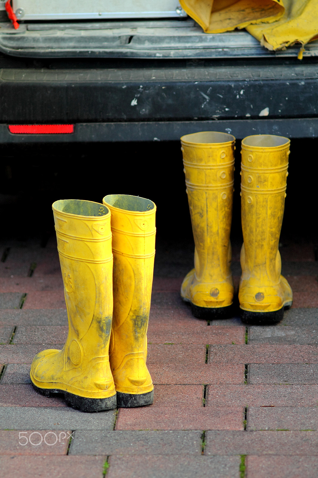 Canon EF 35-80mm f/4-5.6 sample photo. Dirty worker yellow rubber boots. photography