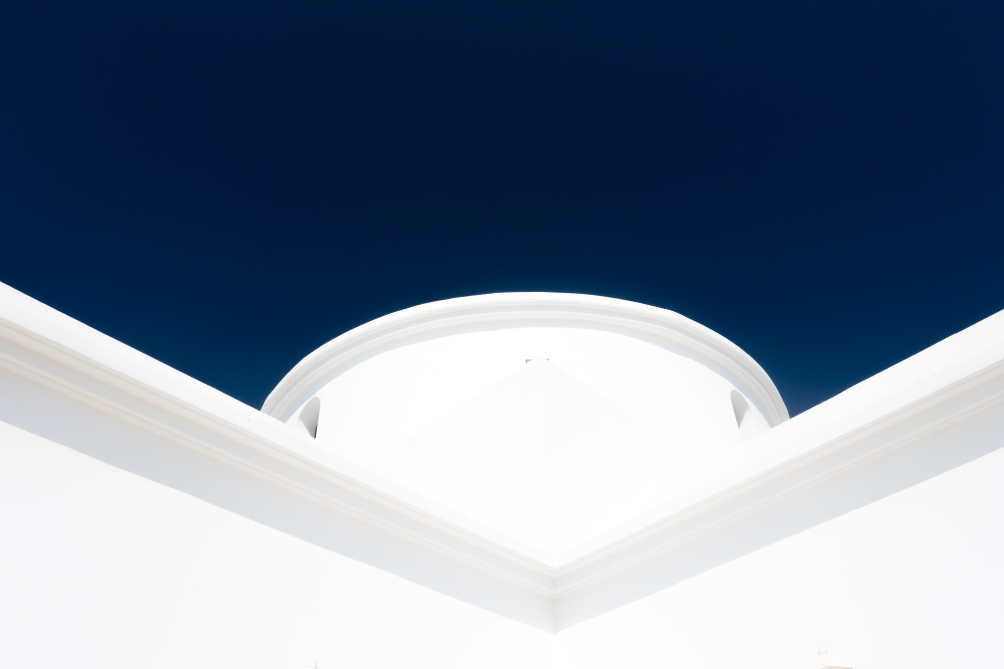 Nikon 1 J5 sample photo. Small greek church in cyprus, minimalist viewpoint, with midnight blue sky photography