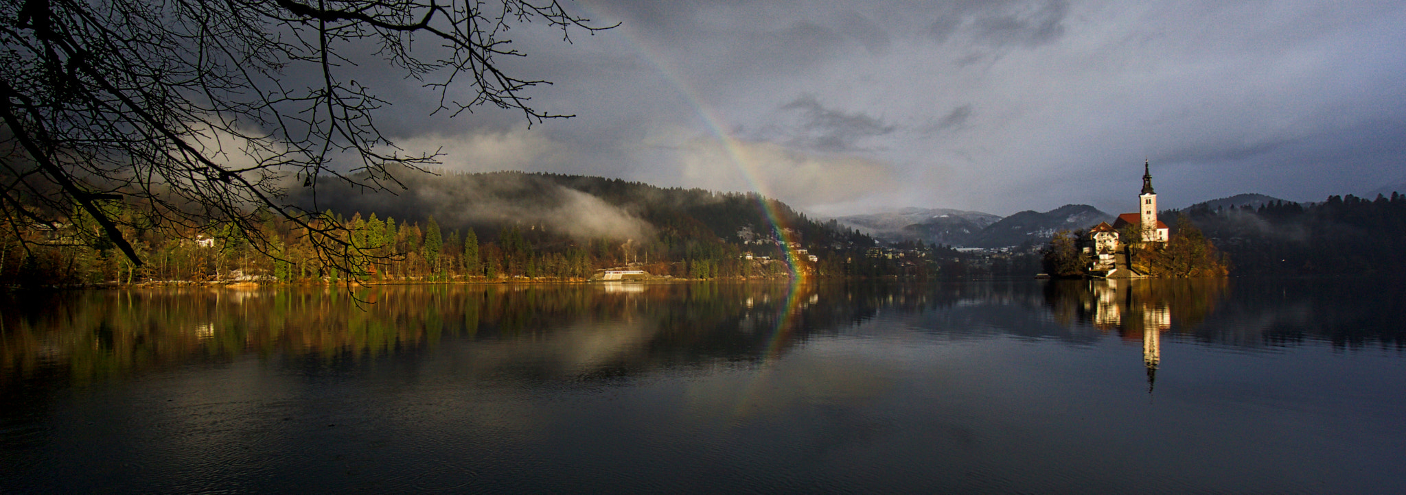 Sony a6000 + Sony E 10-18mm F4 OSS sample photo. Rainbow on lake bled photography