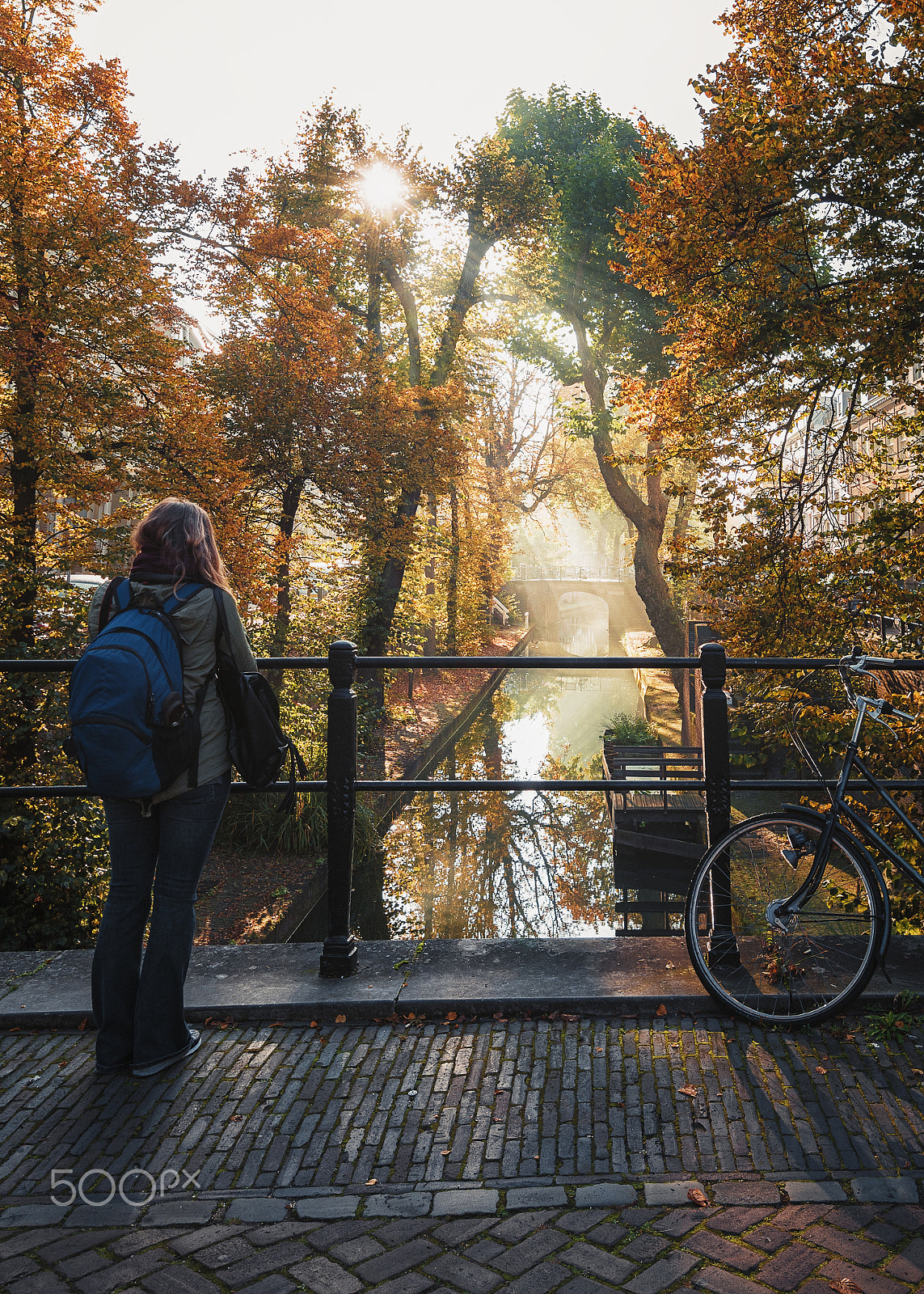 Nikon AF-S Nikkor 16-35mm F4G ED VR sample photo. Young woman hypnotized by the beautiful sunrise and fall. photography