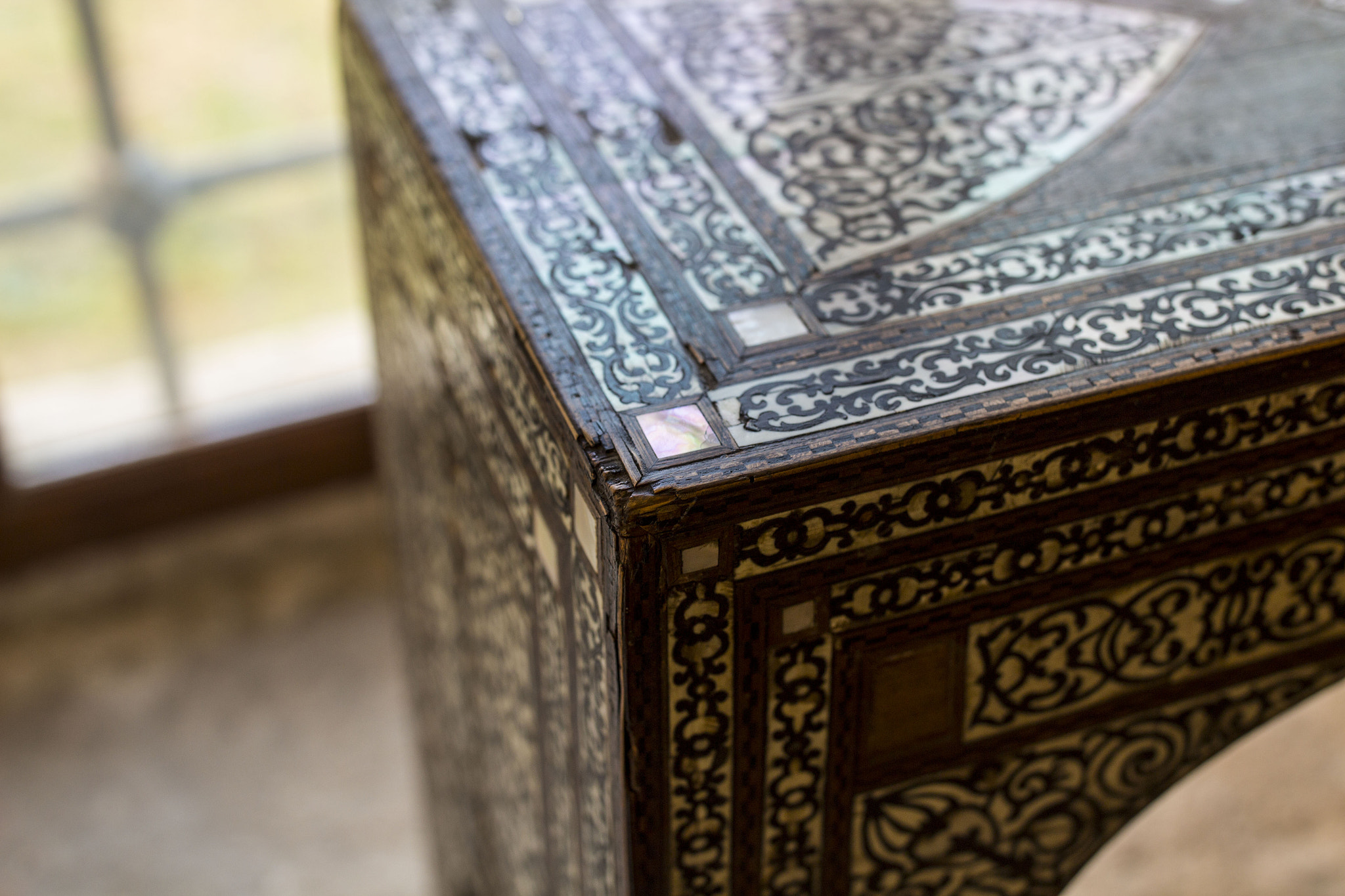 Canon EF 35mm F1.4L II USM sample photo. Detail of a small hand made wooden historical table  photography