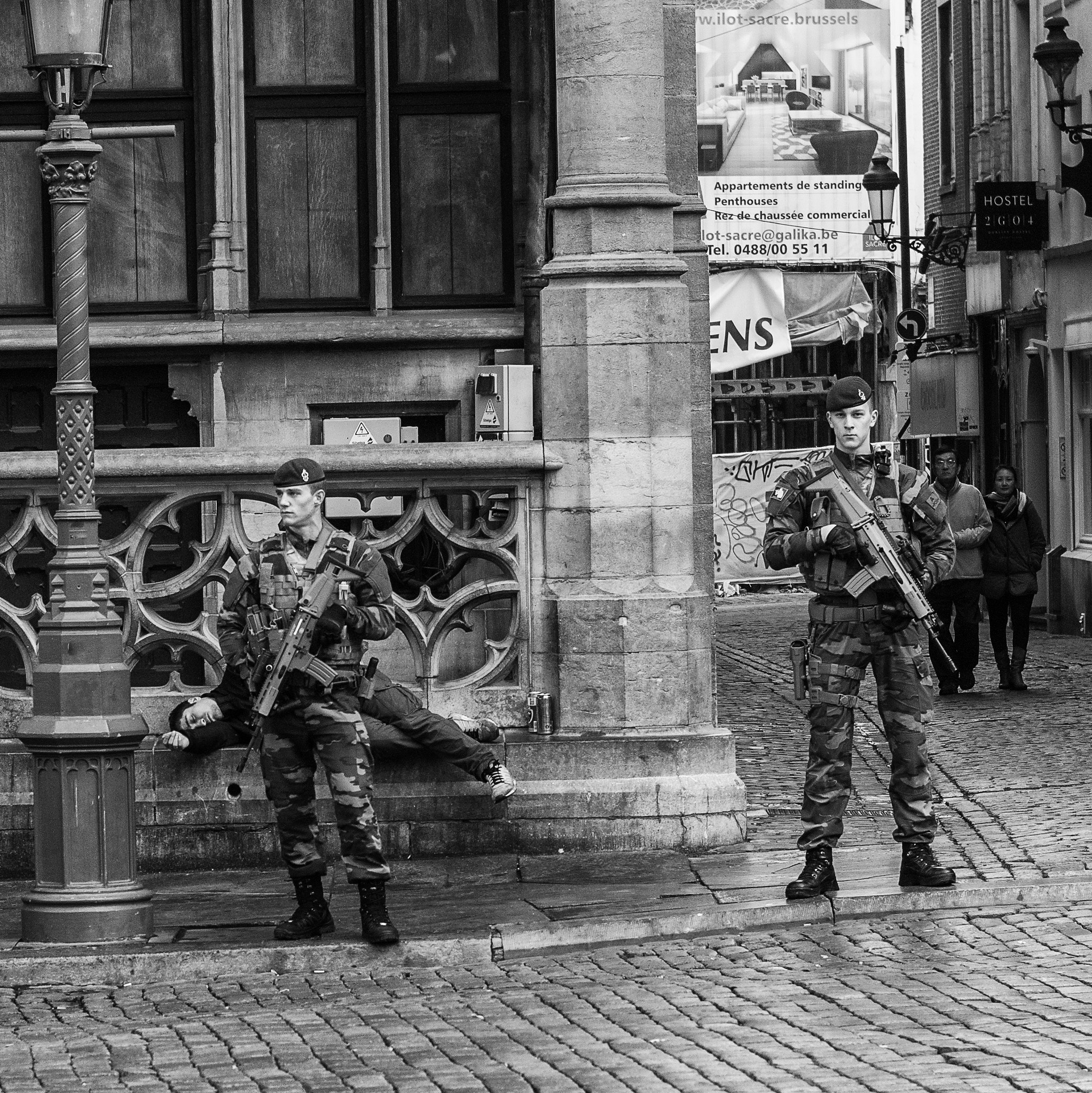 Leica M9 + Leica Macro-Elmar-M 90mm F4 sample photo. Two soldiers protecting a homeless person? photography