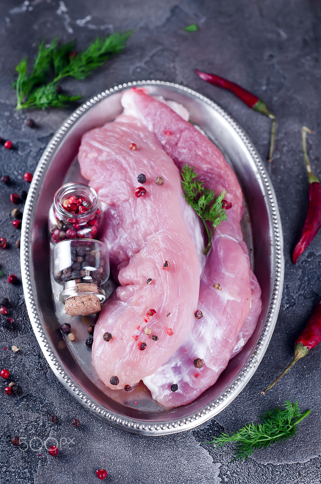 Nikon D90 + AF Nikkor 50mm f/1.8 sample photo. Raw juicy tenderloin with seasonings on a iron tray ready for roasting. photography