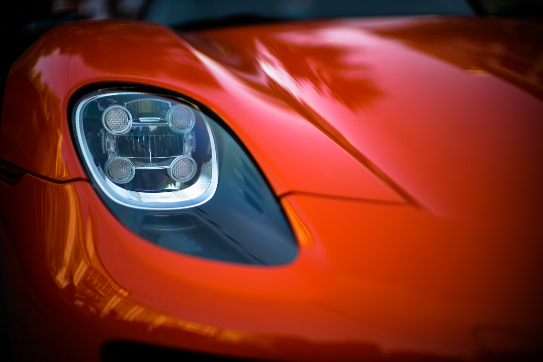 Leica Noctilux-M 50mm F0.95 ASPH sample photo. Continental orange porsche 918 spyder, headlamp photography