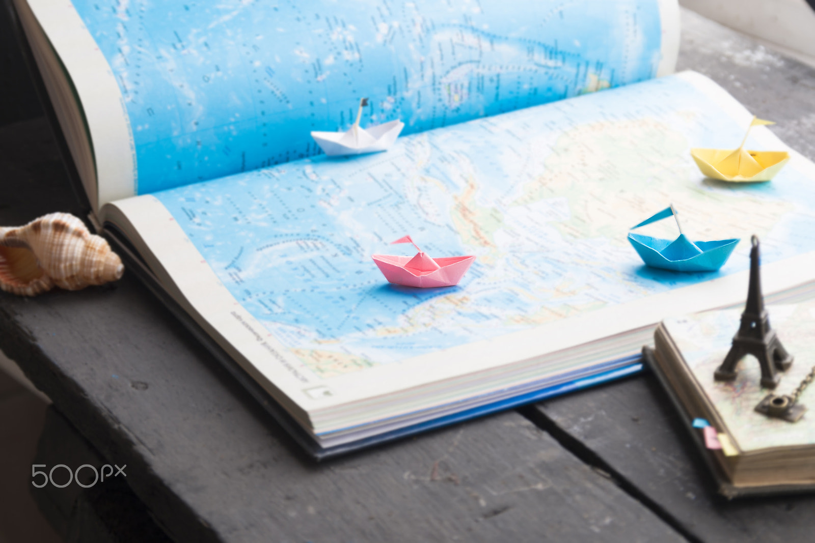 Sigma 18-200mm f/3.5-6.3 DC OS sample photo. Tour packages or travel agent idea. paper boats and map. photography