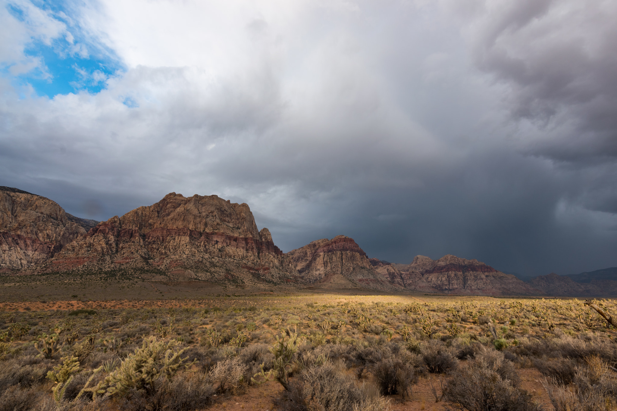 Nikon D5500 + Tokina AT-X 11-20 F2.8 PRO DX (AF 11-20mm f/2.8) sample photo. Storm rolling in near red rock canyon photography