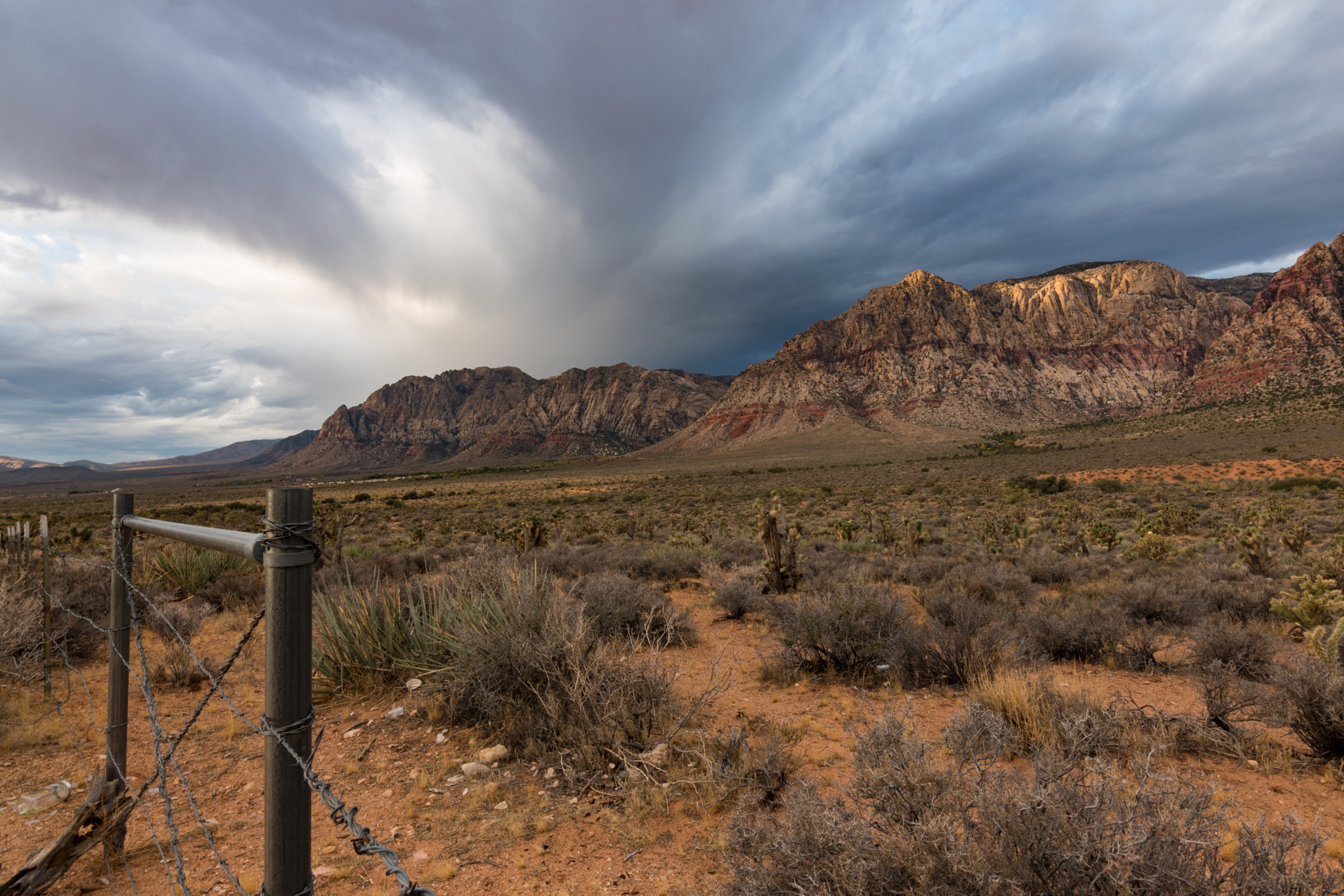 Nikon D5500 + Tokina AT-X 11-20 F2.8 PRO DX (AF 11-20mm f/2.8) sample photo. Storm rolling in near red rock canyon photography