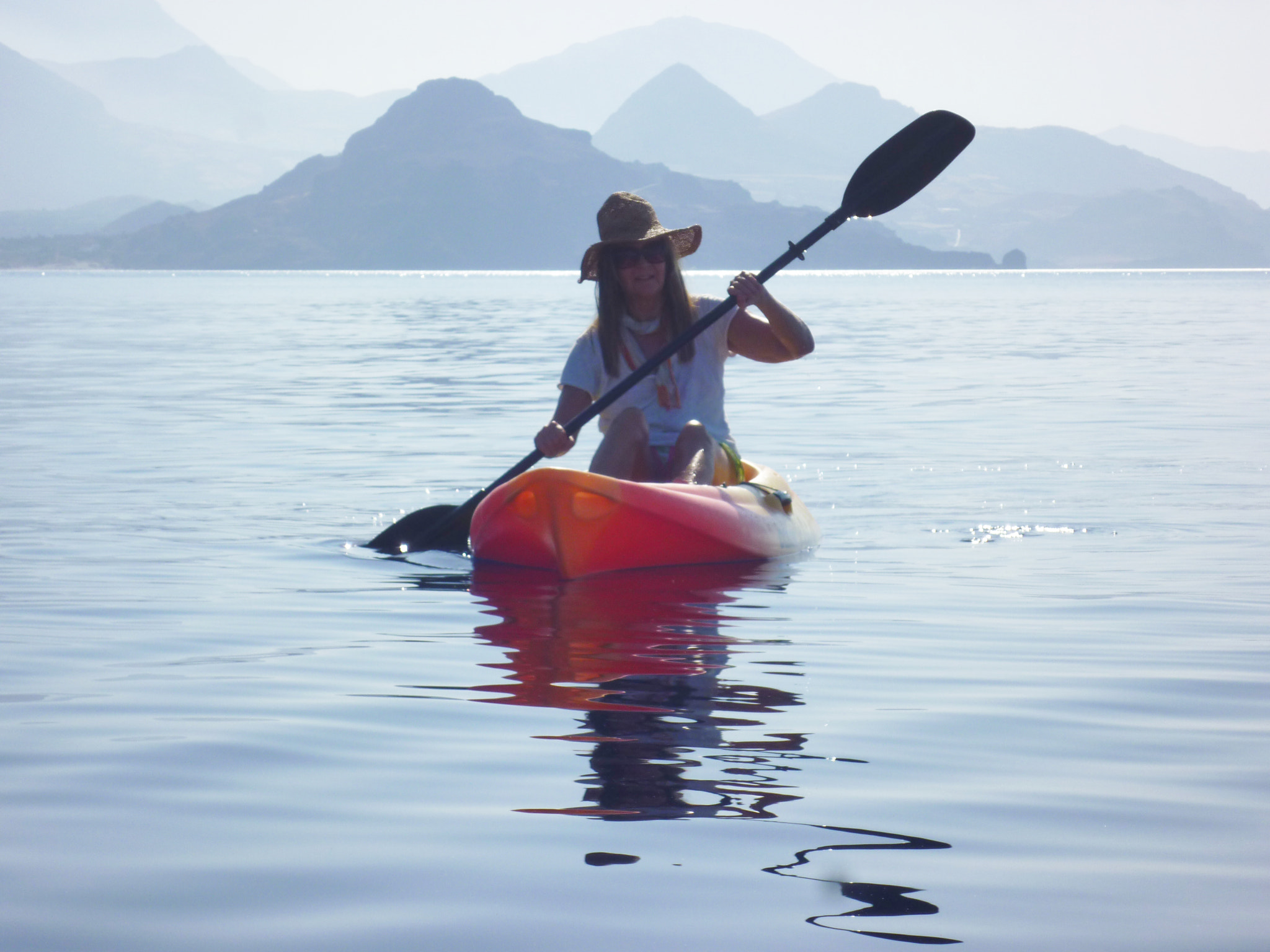 Panasonic DMC-FX60 sample photo. Young lady kayaking early morning, libyan sea photography