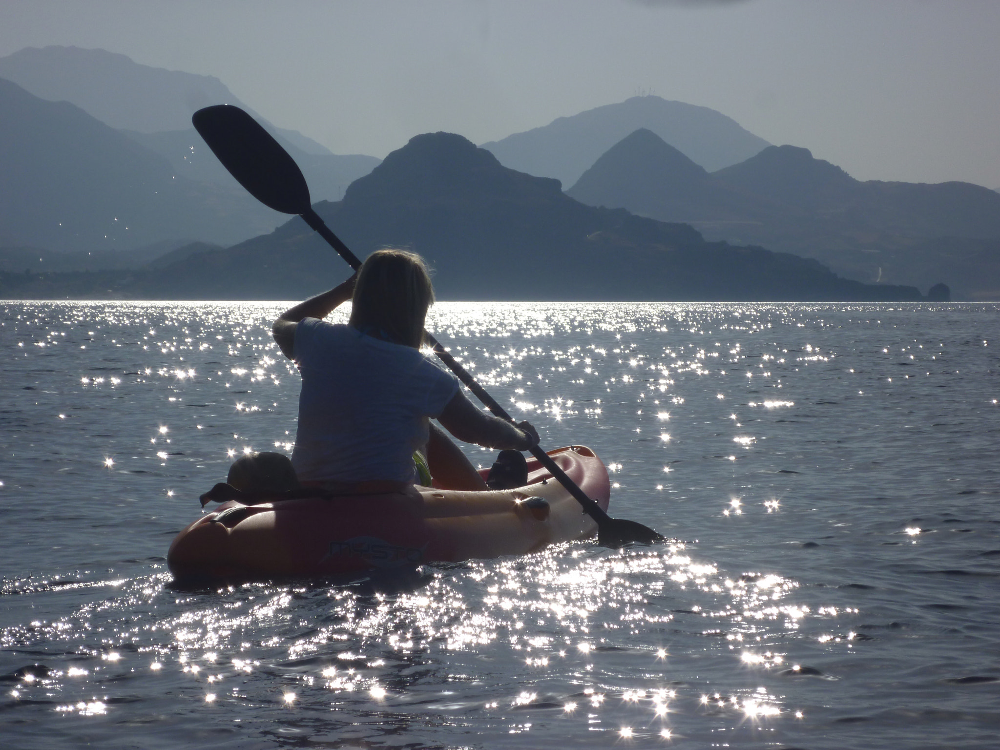 Panasonic DMC-FX60 sample photo. Young lady kayaking early morning, libyan sea photography