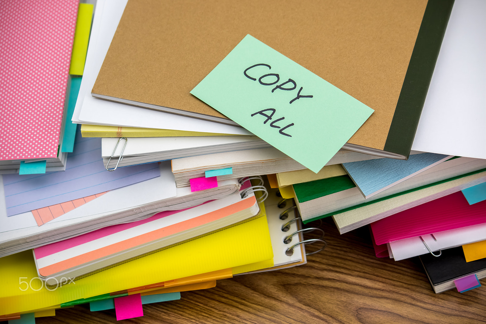 Canon EF-S 55-250mm F4-5.6 IS sample photo. Copy all; the pile of business documents on the desk photography