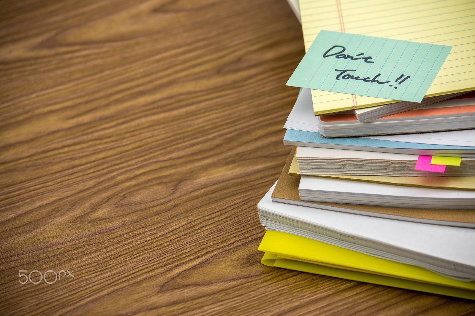 Canon EF-S 55-250mm F4-5.6 IS sample photo. Do not touch; the pile of business documents on the desk photography