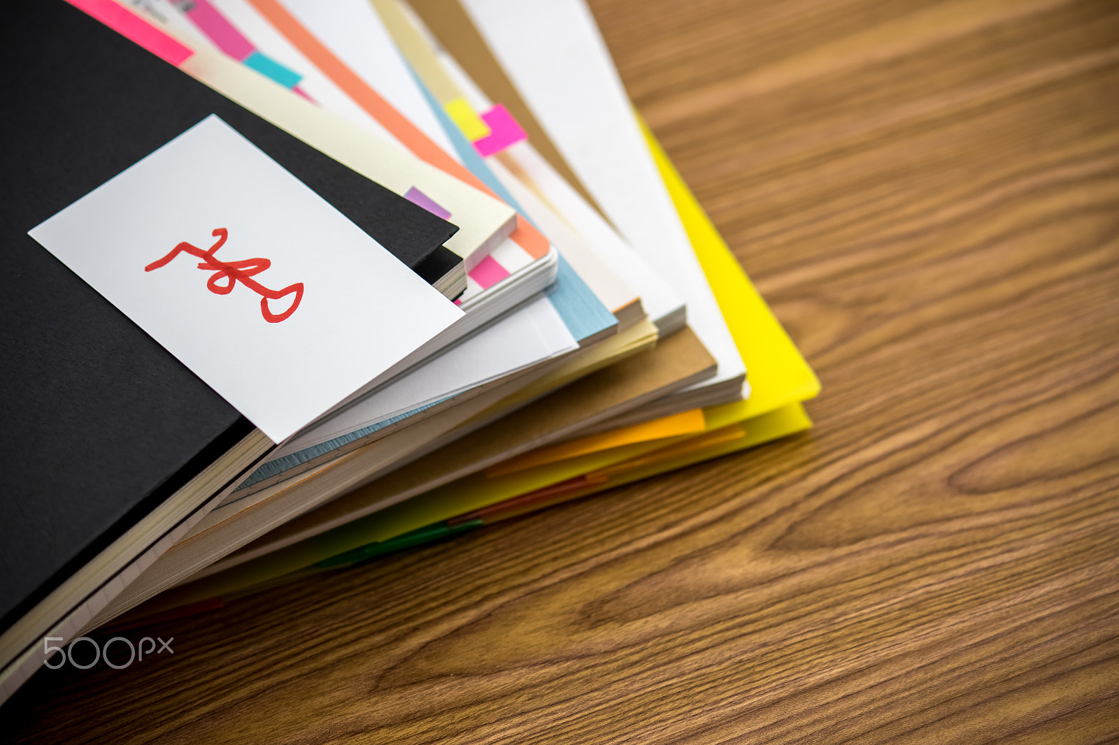 Canon EF-S 55-250mm F4-5.6 IS sample photo. Important; the pile of business documents on the desk photography