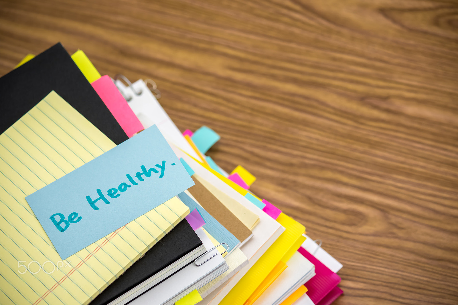 Canon EF-S 55-250mm F4-5.6 IS sample photo. Be healthy; the pile of business documents on the desk photography