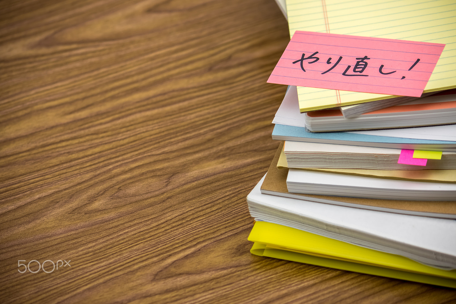 Canon EF-S 55-250mm F4-5.6 IS sample photo. Redo; the pile of business documents on the desk photography