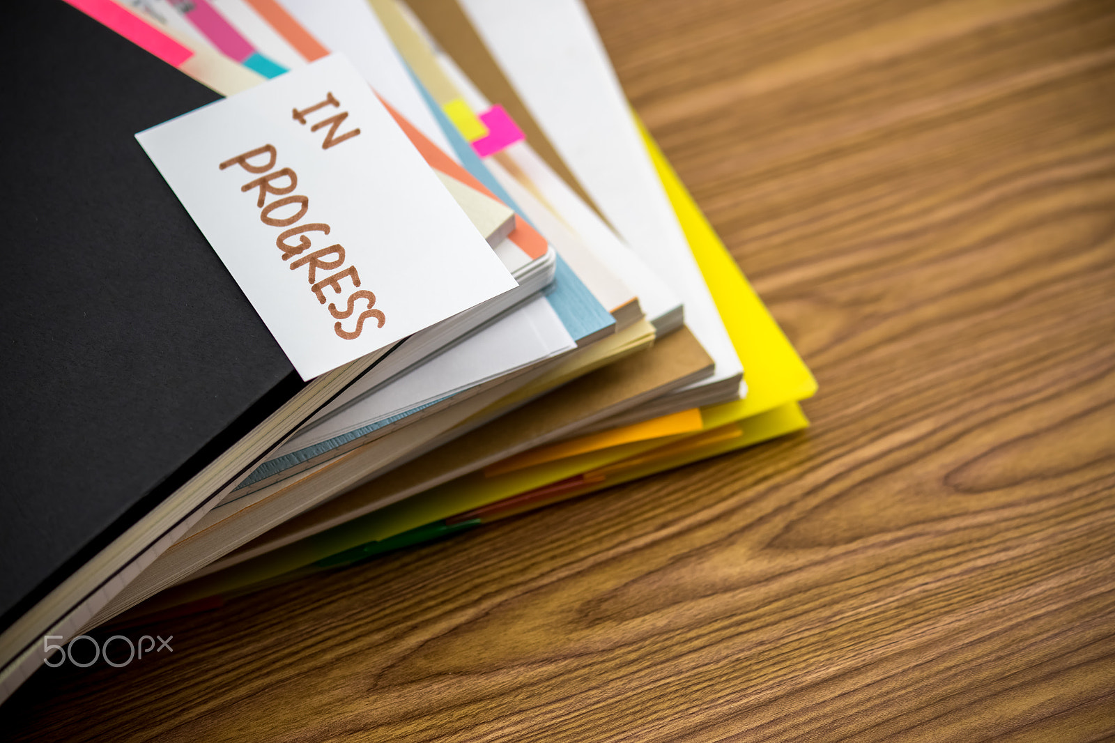 Canon EF-S 55-250mm F4-5.6 IS sample photo. In progress; the pile of business documents on the desk photography