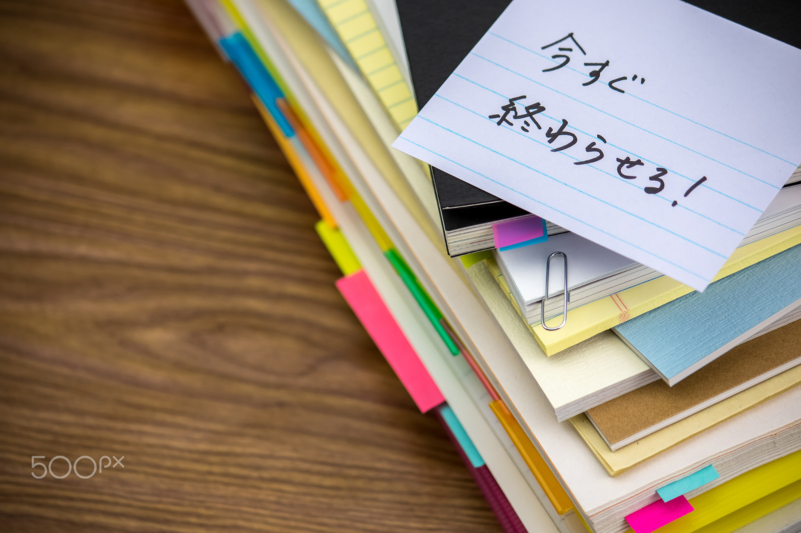 Canon EF-S 55-250mm F4-5.6 IS sample photo. Do now; the pile of business documents on the desk photography