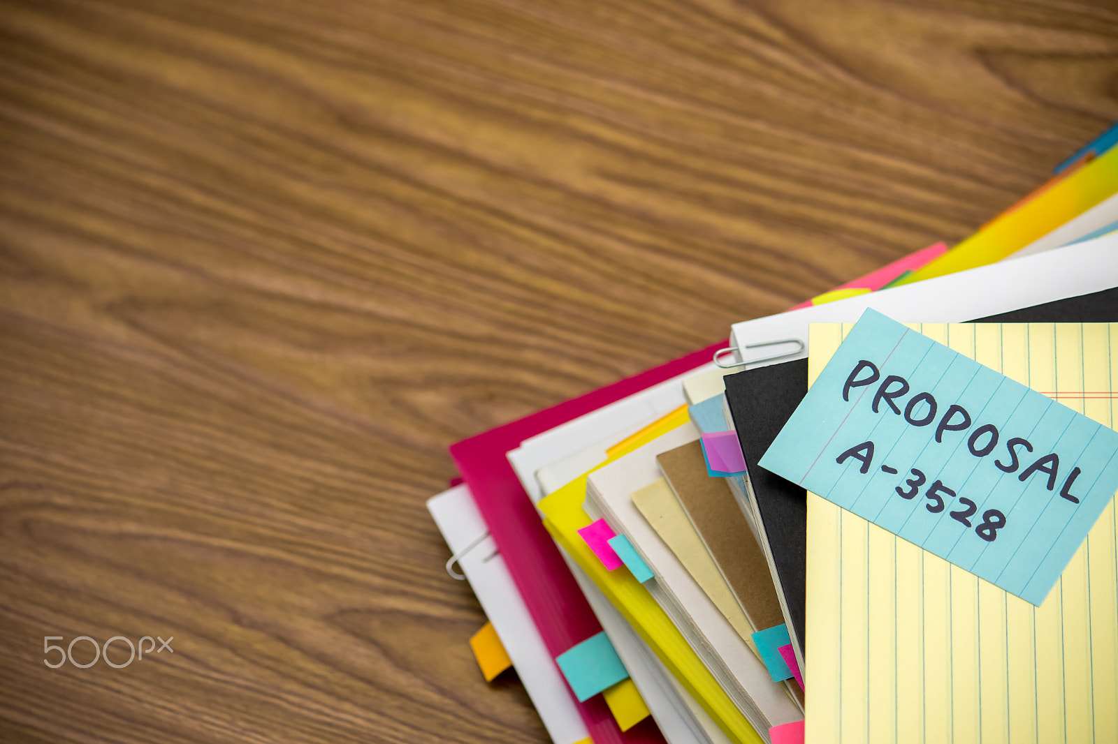 Canon EF-S 55-250mm F4-5.6 IS sample photo. Proposal; the pile of business documents on the desk photography